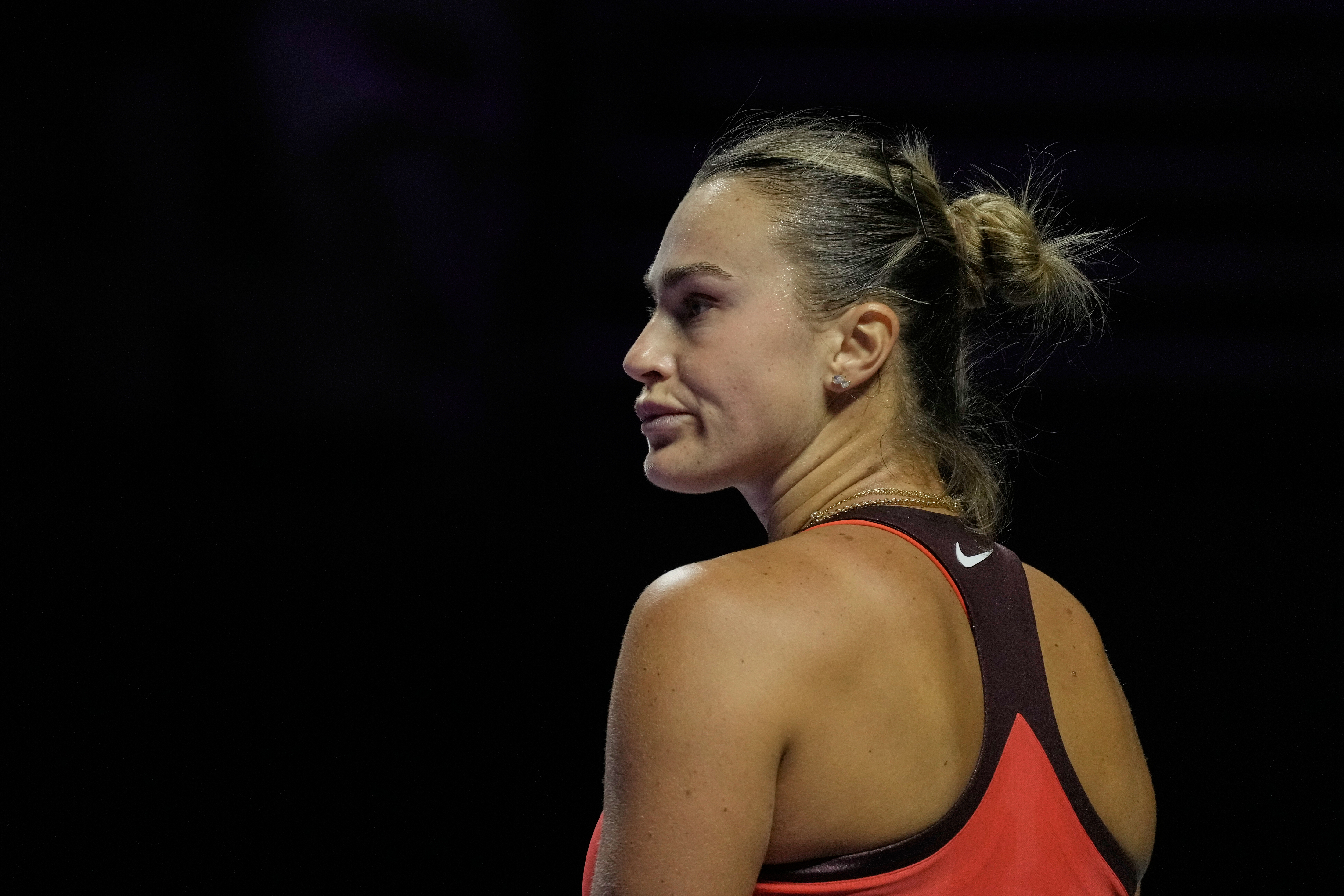 Aryna Sabalenka of Belarus reacts during the women's final singles match of the WTA finals in Riyadh, Saudi Arabia, Saturday, Nov. 8, 2025. (AP Photo/ Fatima Shbair)