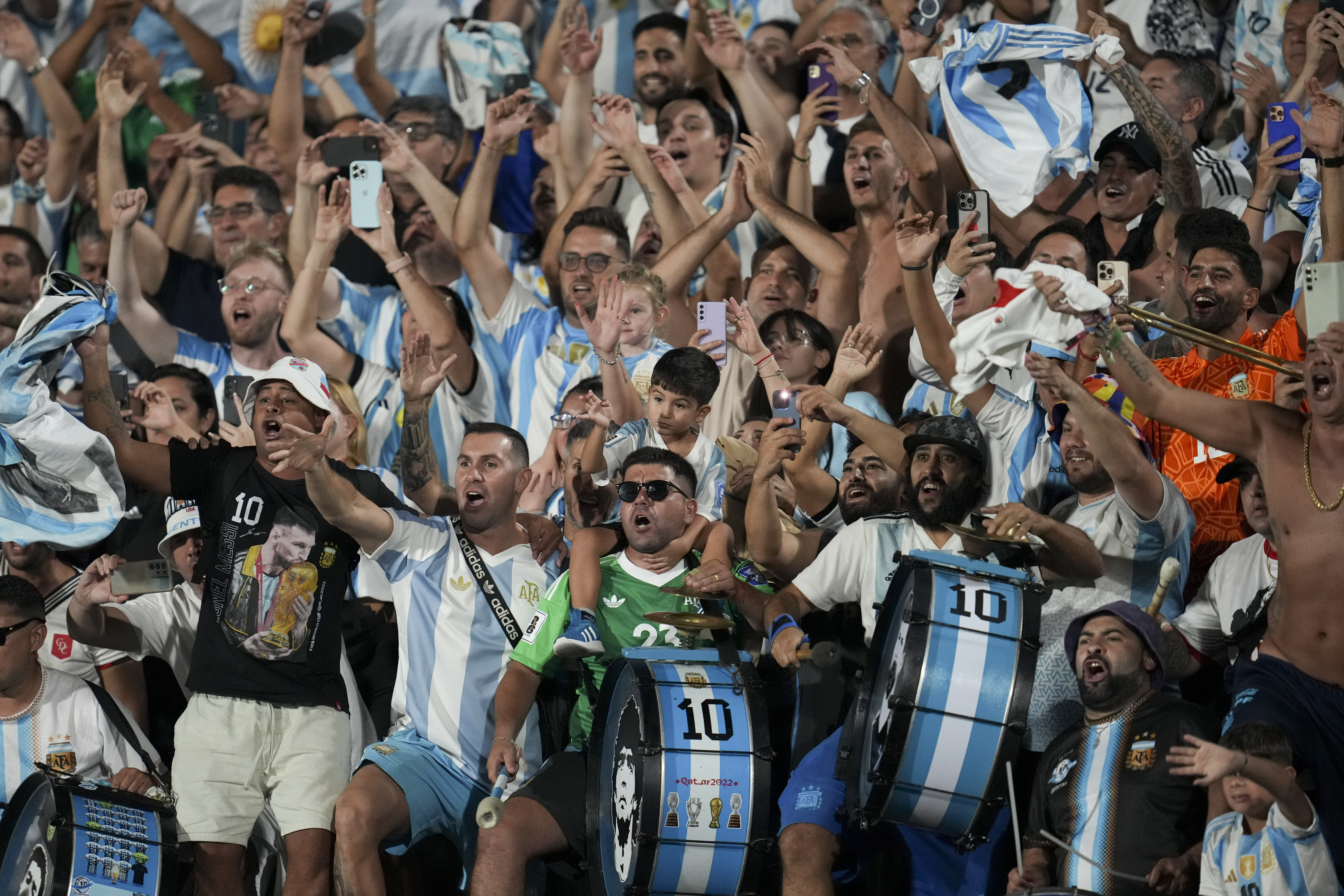Fans of Argentina celebrate as their team defeated Uruguay during a qualifying soccer match for the FIFA World Cup 2026 in Montevideo, Uruguay, Friday, March 21, 2025. (AP Photo/Matilde Campodonico)
