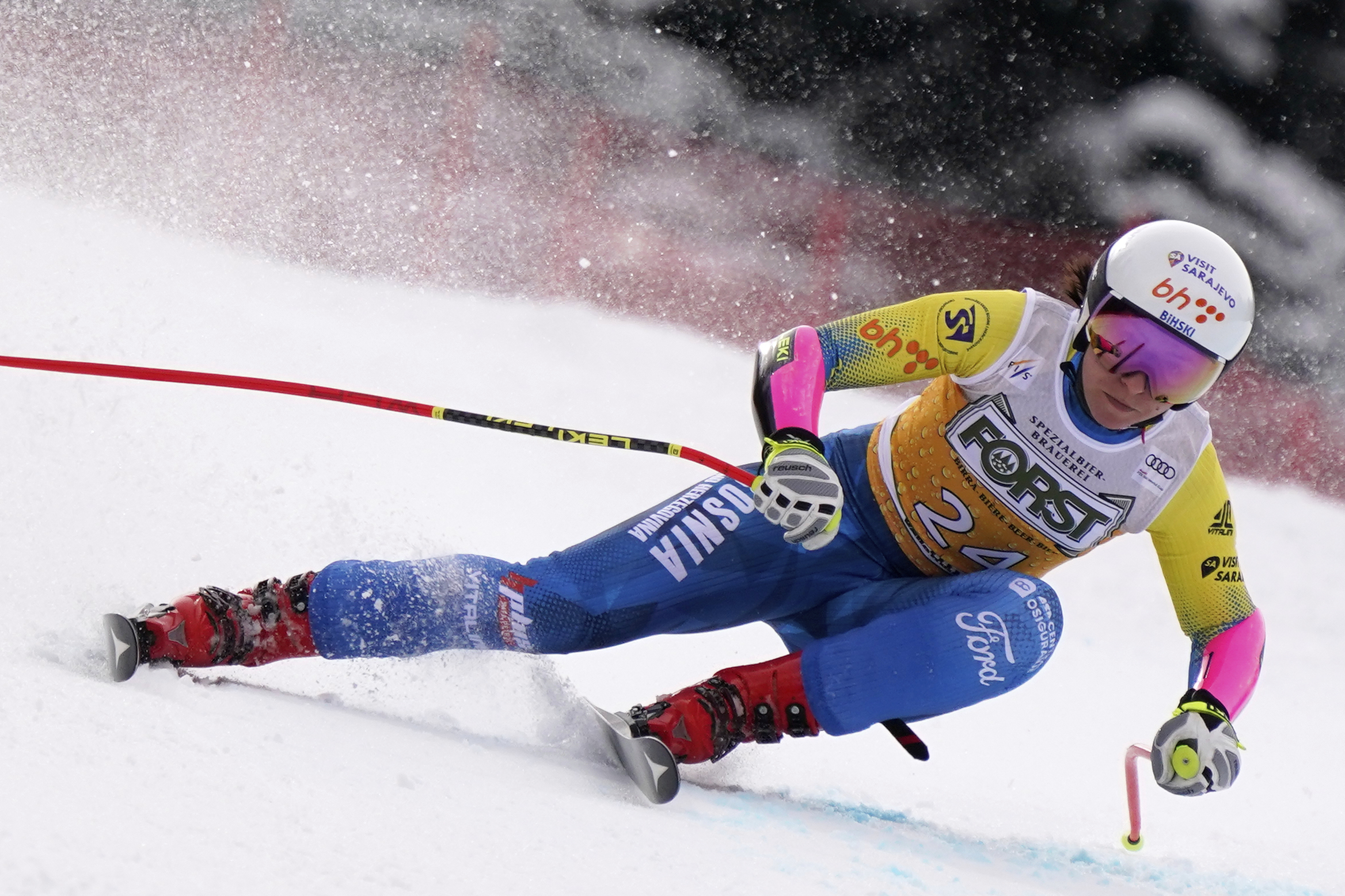 Bosnia And Herzegovina's Elvedina Muzaferija speeds down the course of an alpine ski, women's World Cup super G race, in La Thuile, Italy, Thursday, March 13, 2025. (AP Photo/Piermarco Tacca)