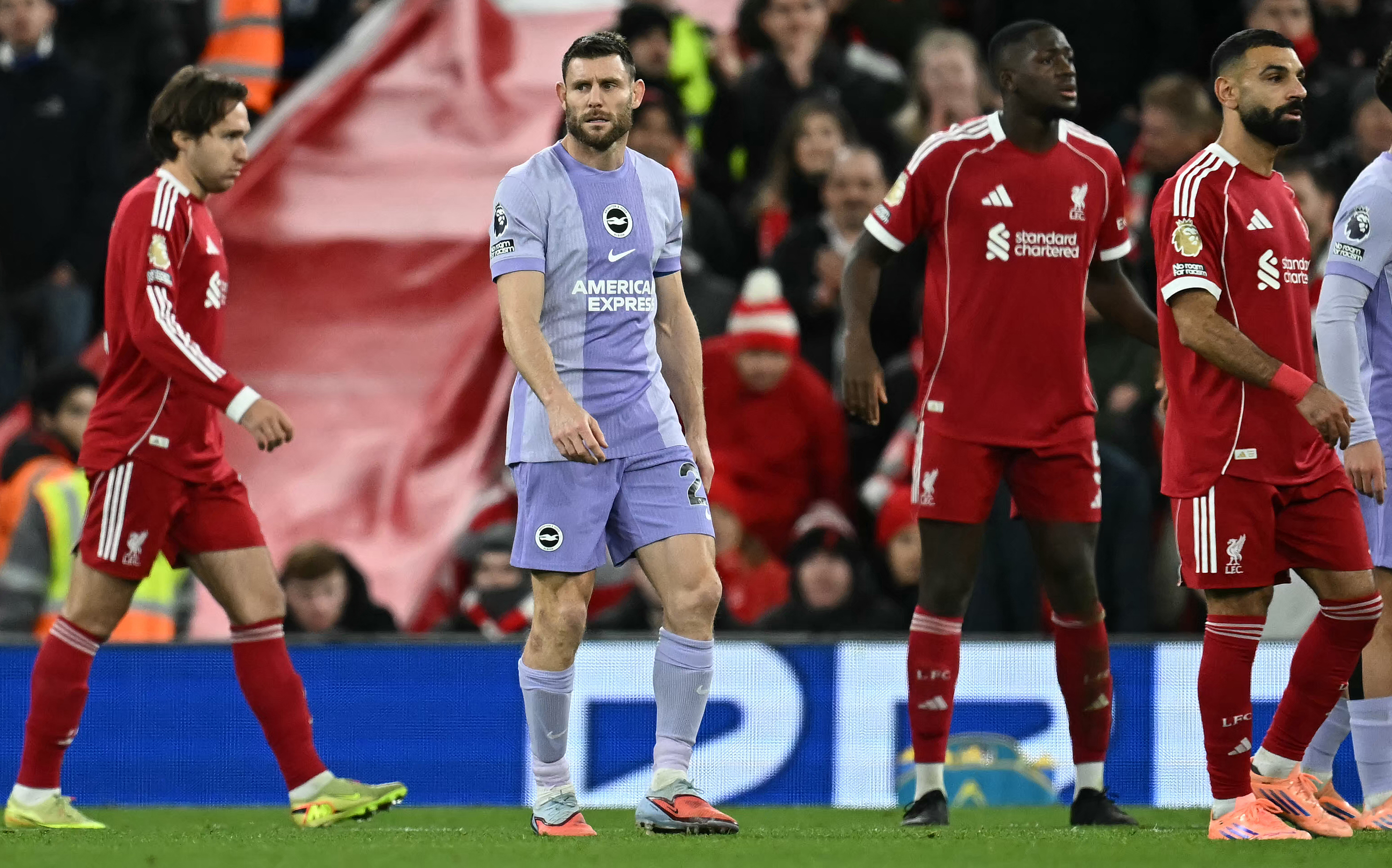 Brighton's English midfielder #06 James Milner (2L) reacts during the English Premier League football match between Liverpool and Brighton and Hove Albion at Anfield in Liverpool, north west England on December 13, 2025. (Photo by Paul ELLIS / AFP) / REST