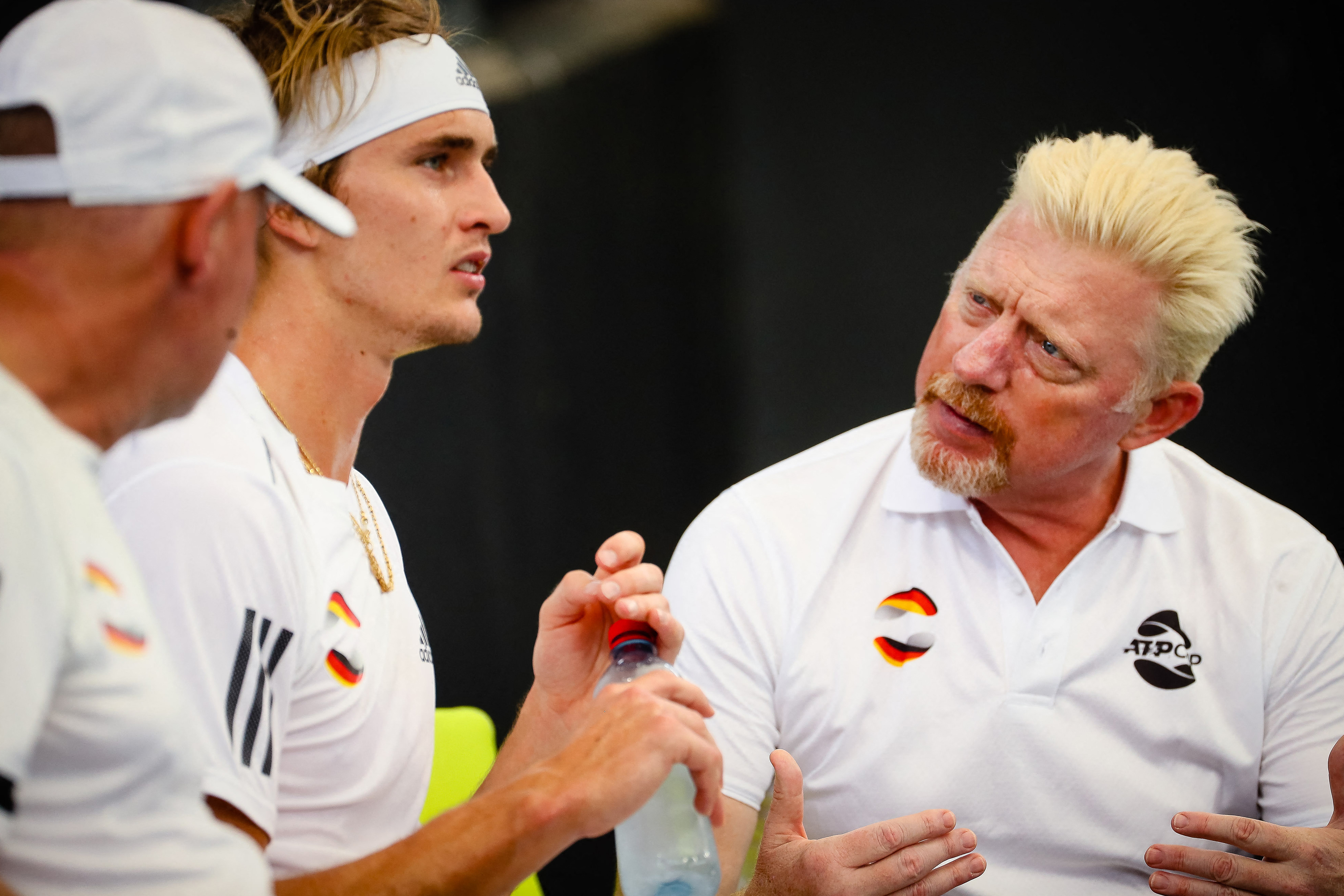 Alexander Zverev of Germany (2nd L) speaks with team captain Boris Becker