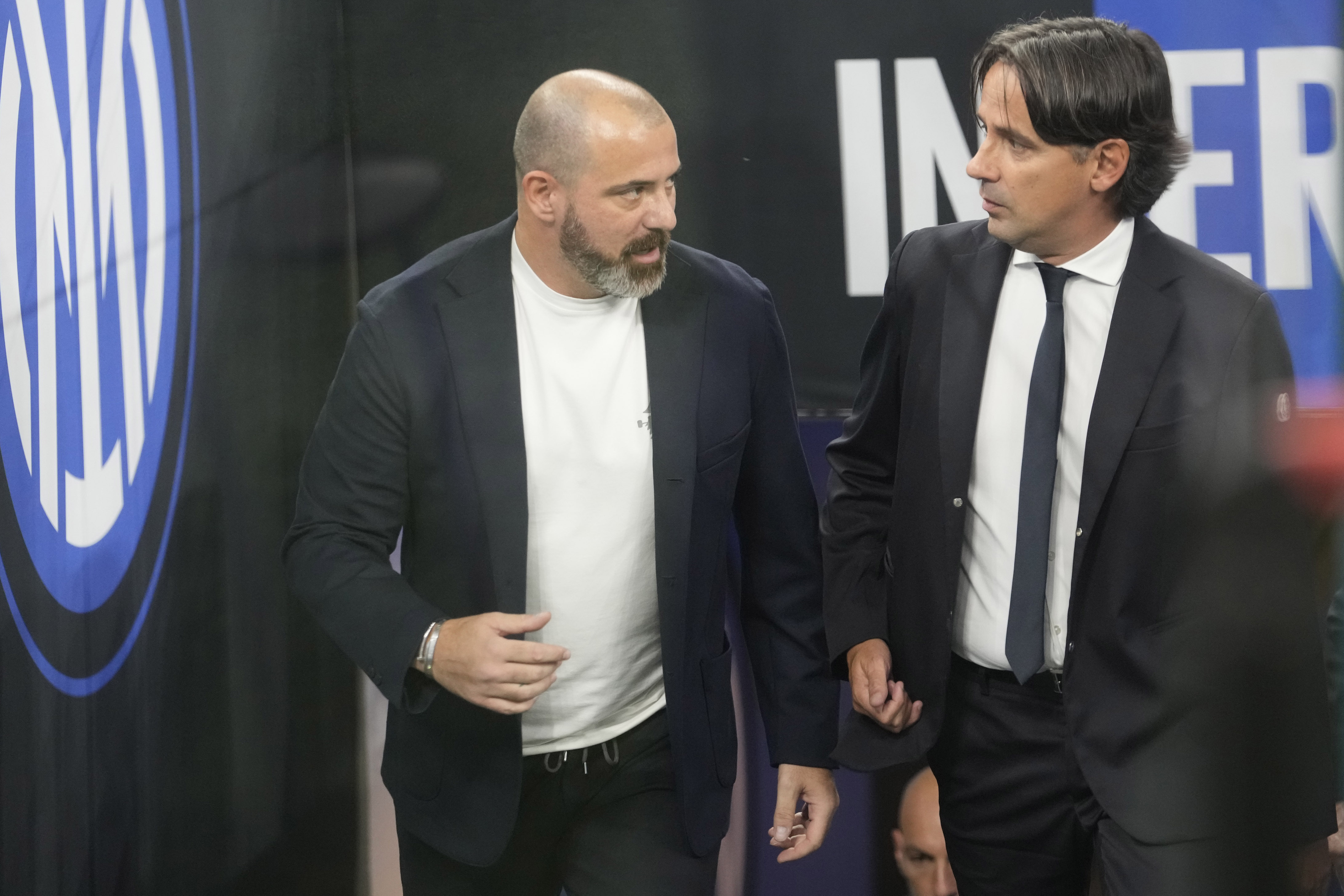 CORRECTS DATE - Sampdoria's head coach Dejan Stankovic is flanked by Inter Milan's head coach Simone Inzaghi prior to the start of a Serie A soccer match between Inter Milan and Sampdoria at the San Siro stadium in Milan, Italy, Saturday, Oct. 29, 2022. (