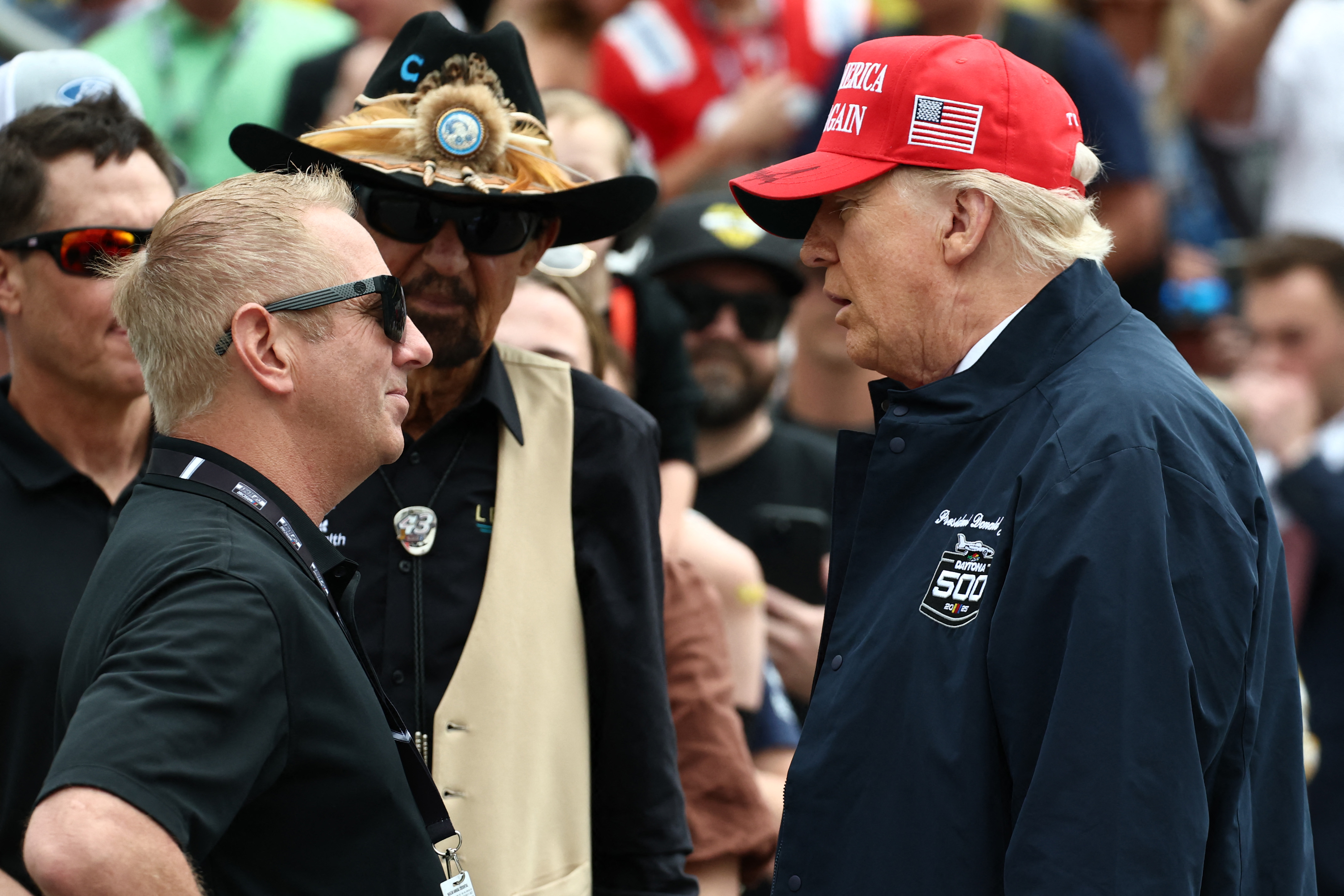 US President Donald Trump speaks to former NASCAR Cup series driver, Greg Biffle