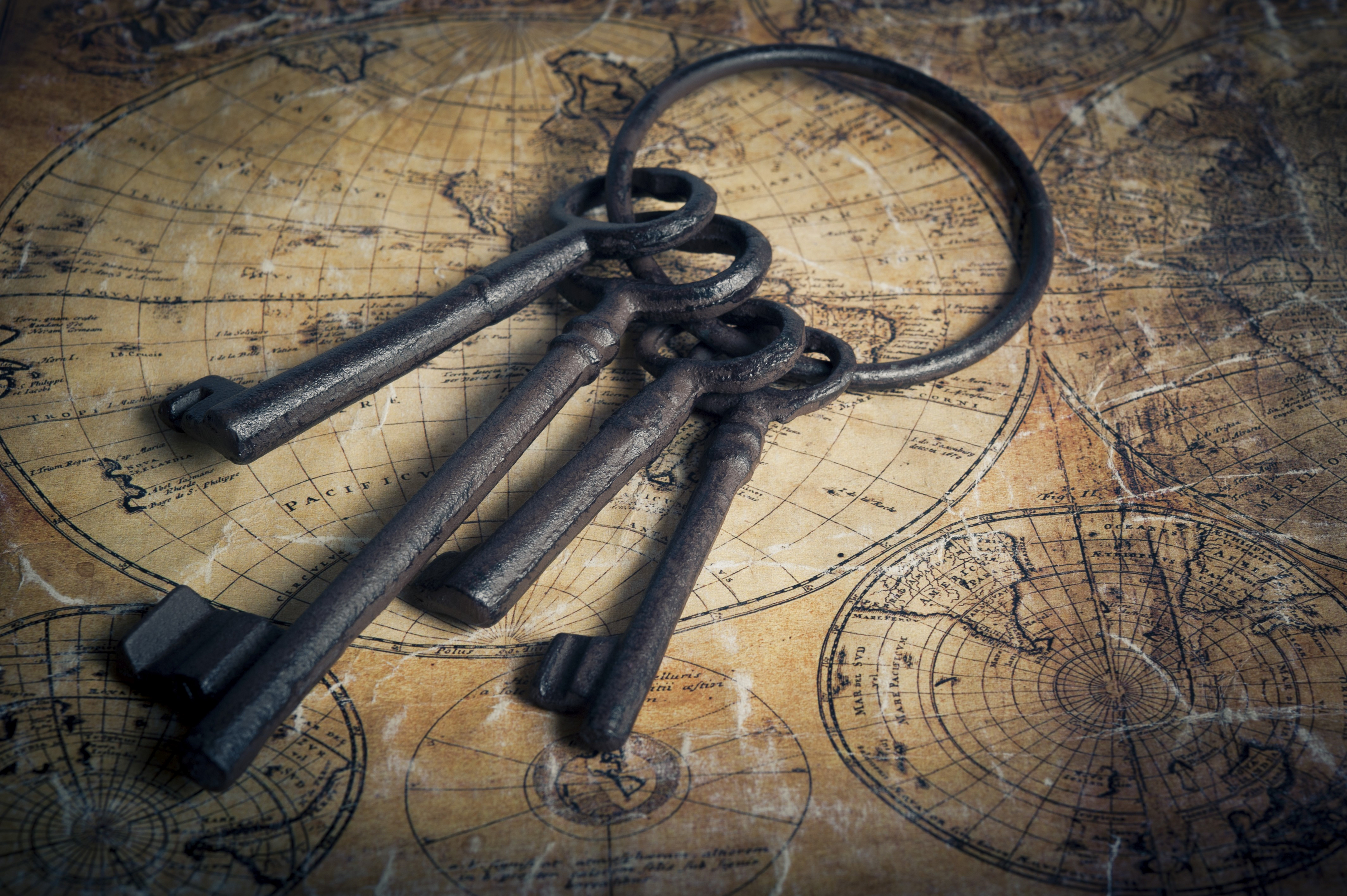Antique keys laid on a vintage map suggesting exploration