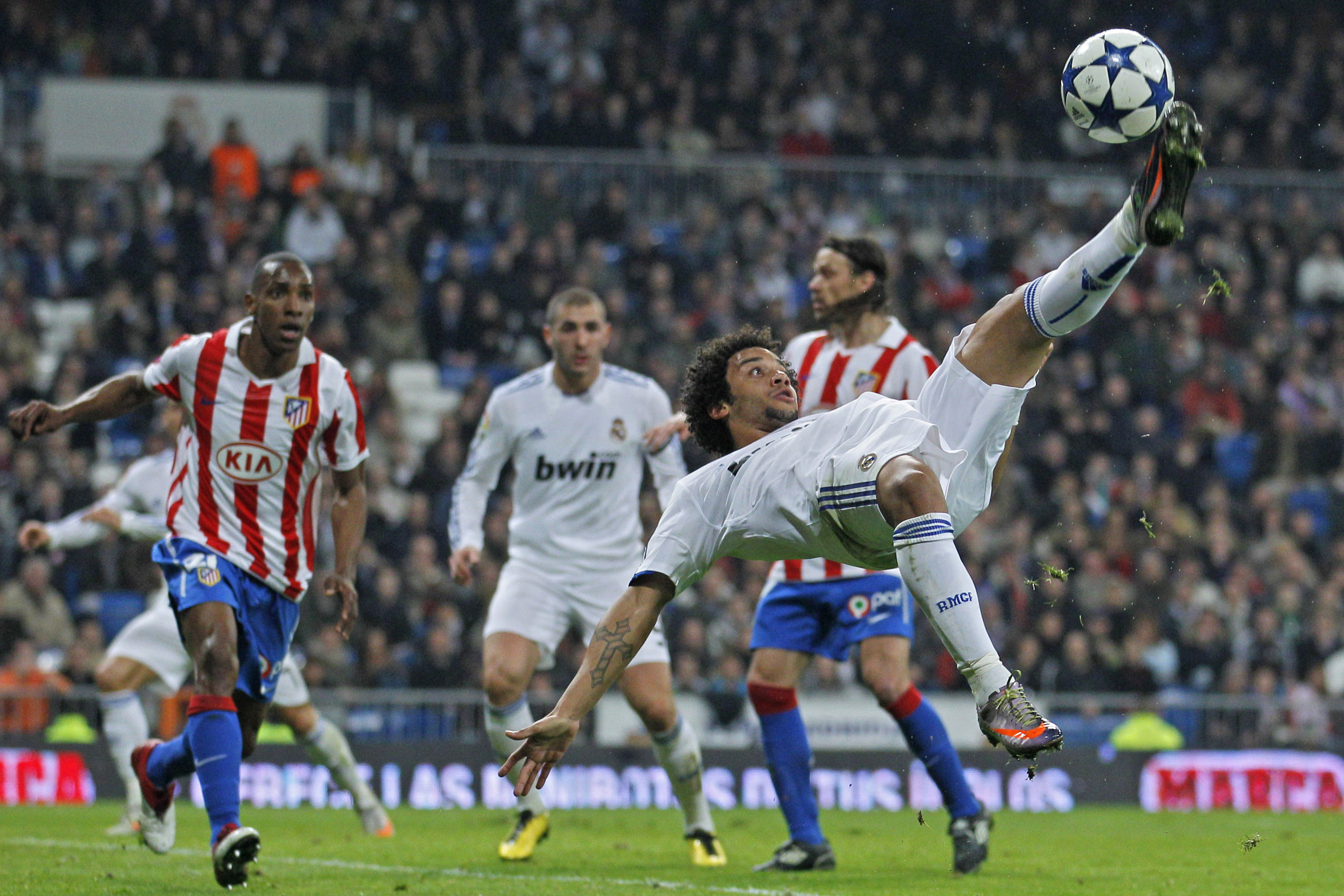 FILE - Real Madrid's Marcelo from Brazil, right, kicks the ball during their Copa del Rey quarterfinal first leg match against Atletico de Madrid at the Santiago Bernabeu stadium in Madrid Jan. 13, 2011. (AP Photo/Victor R. Caivano, File)