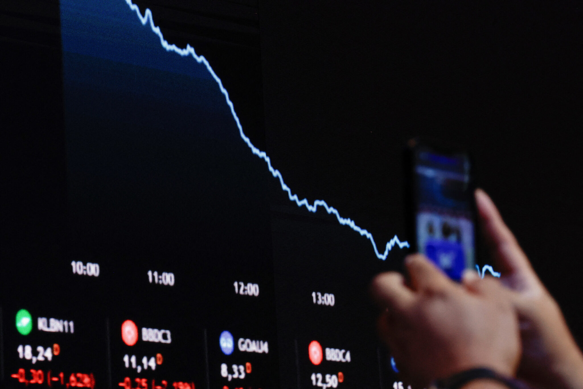An electronic board displays information on recent fluctuations of market indices at the B3 Stock Exchange in Sao Paulo