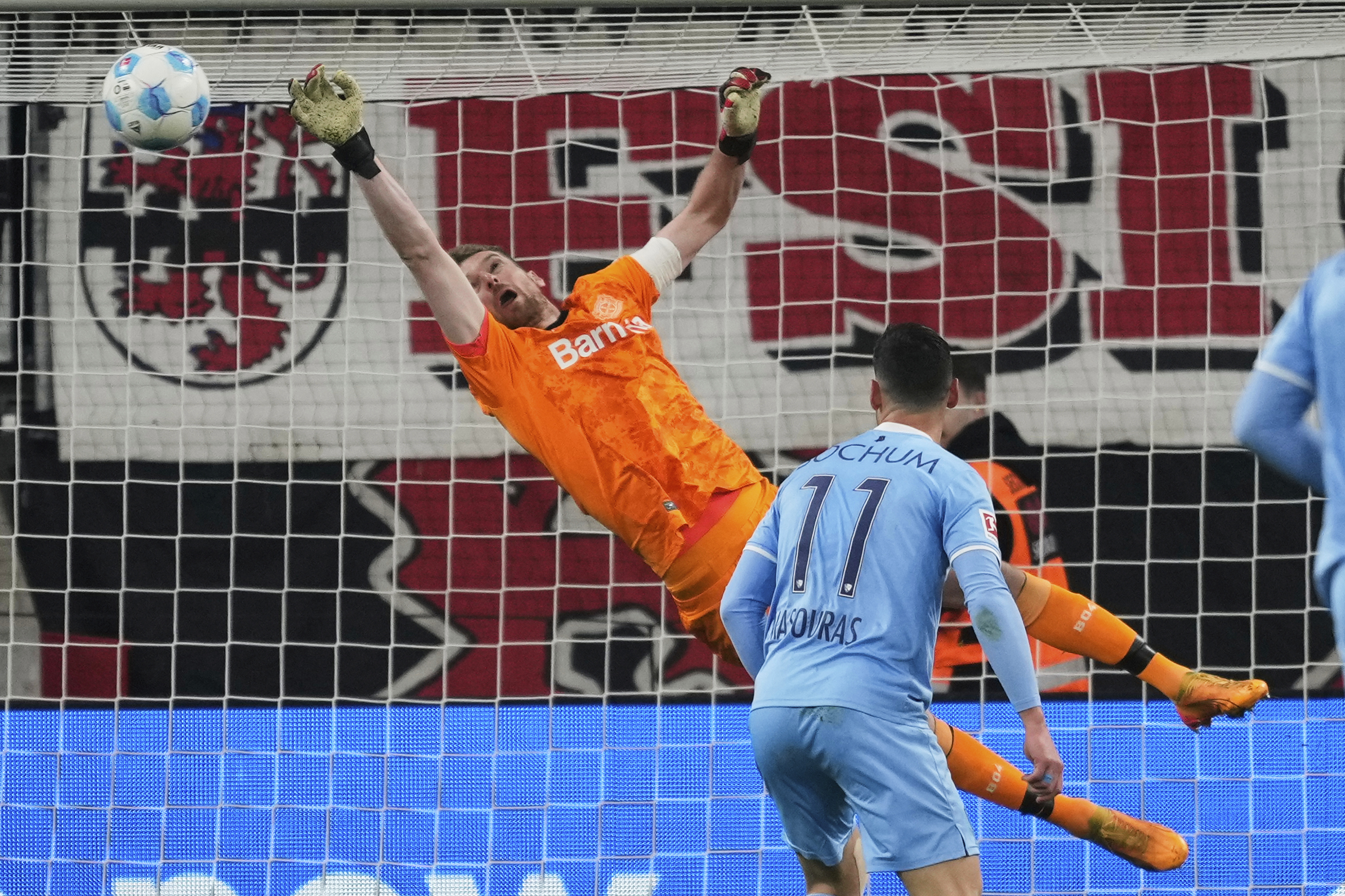 Leverkusen's goalkeeper Lukas Hradecky fails to save the goal during the German Bundesliga soccer match between Bayer Leverkusen and VfL Bochum at the BayArena in Leverkusen, Germany, Friday, March 28, 2025. (AP Photo/Martin Meissner)