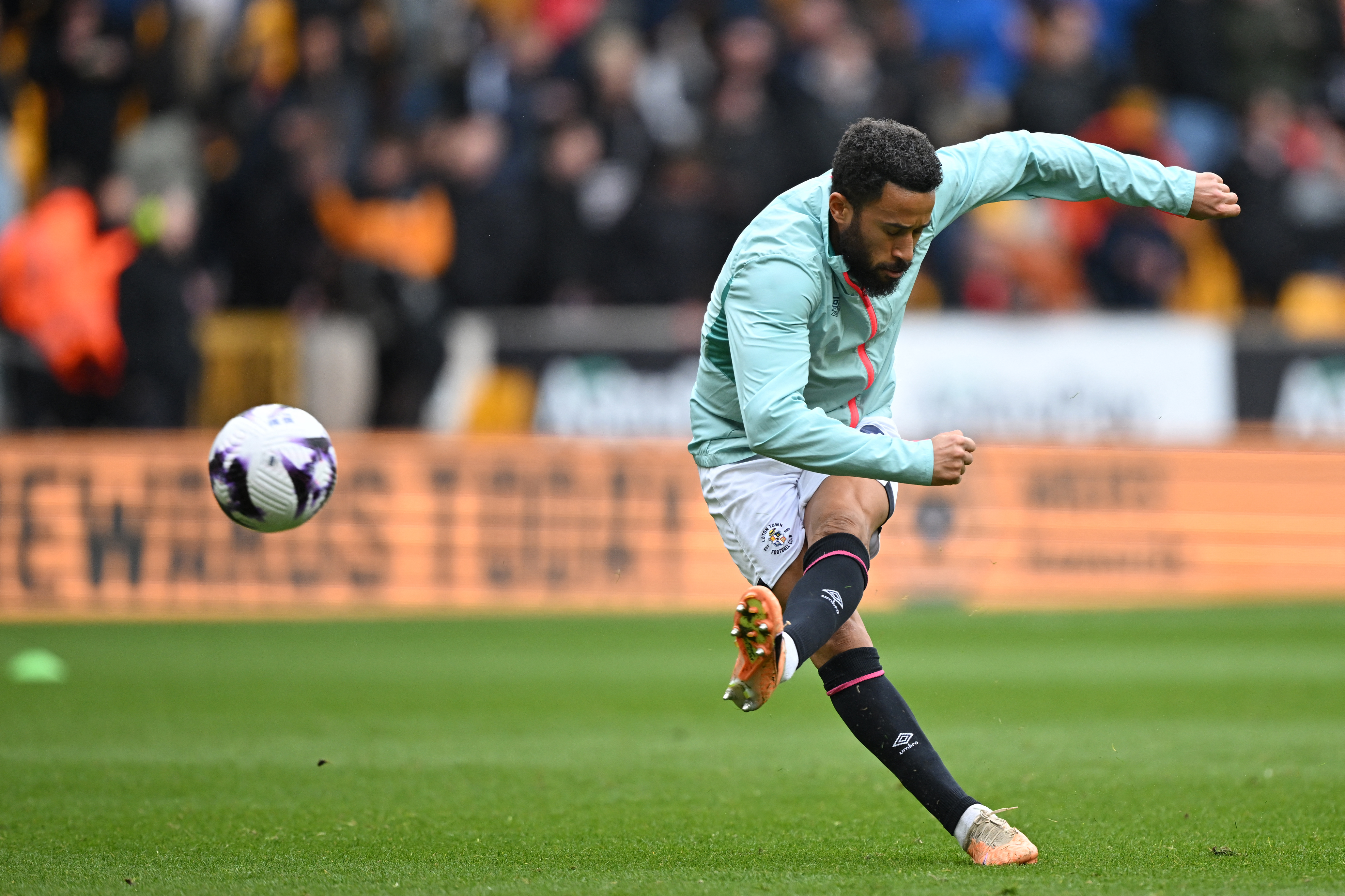 Luton Town's English midfielder #30 Andros Townsend warms up ahead of the English Premier League football match between Wolverhampton Wanderers and Luton Town