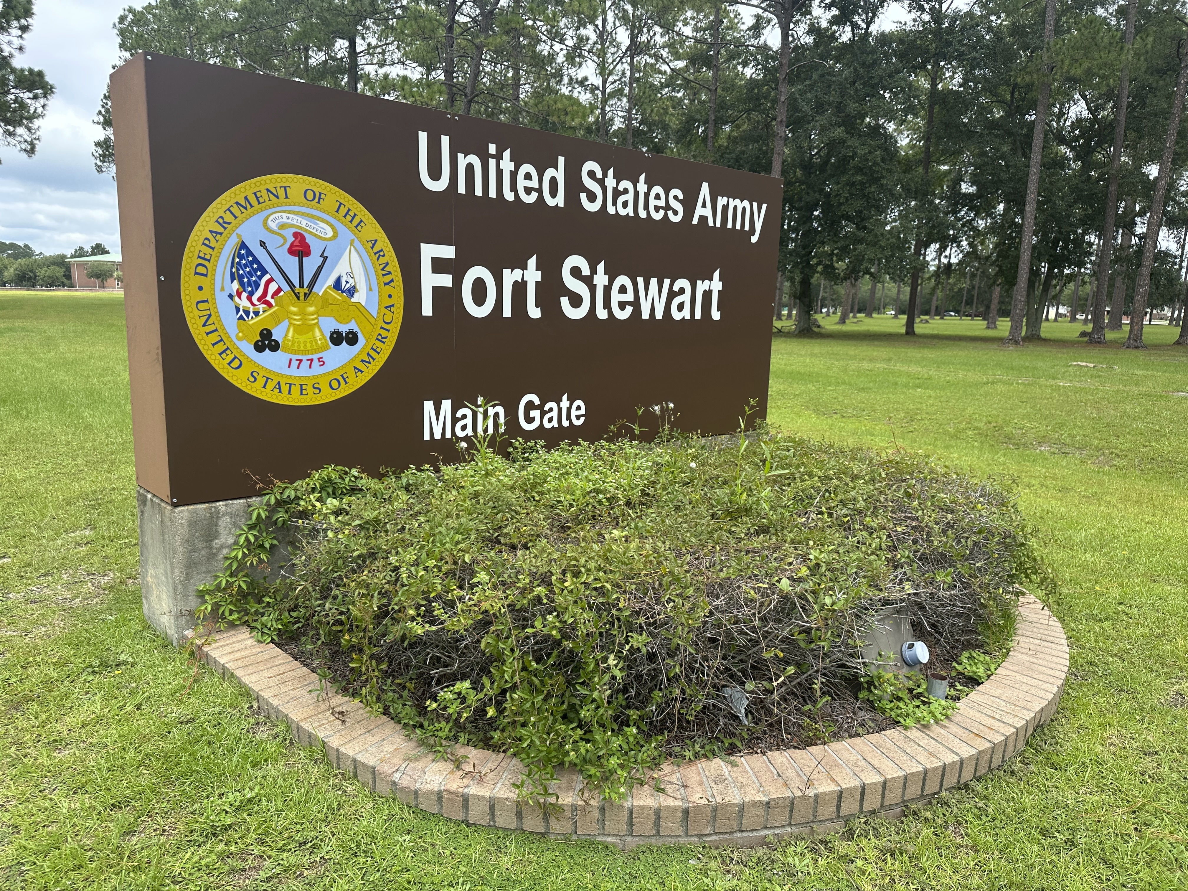 A sign outside the main gate of Fort Stewart, Georgia, is shown on Wednesday, Aug. 6, 2025. (AP Photo/Russ Bynum)