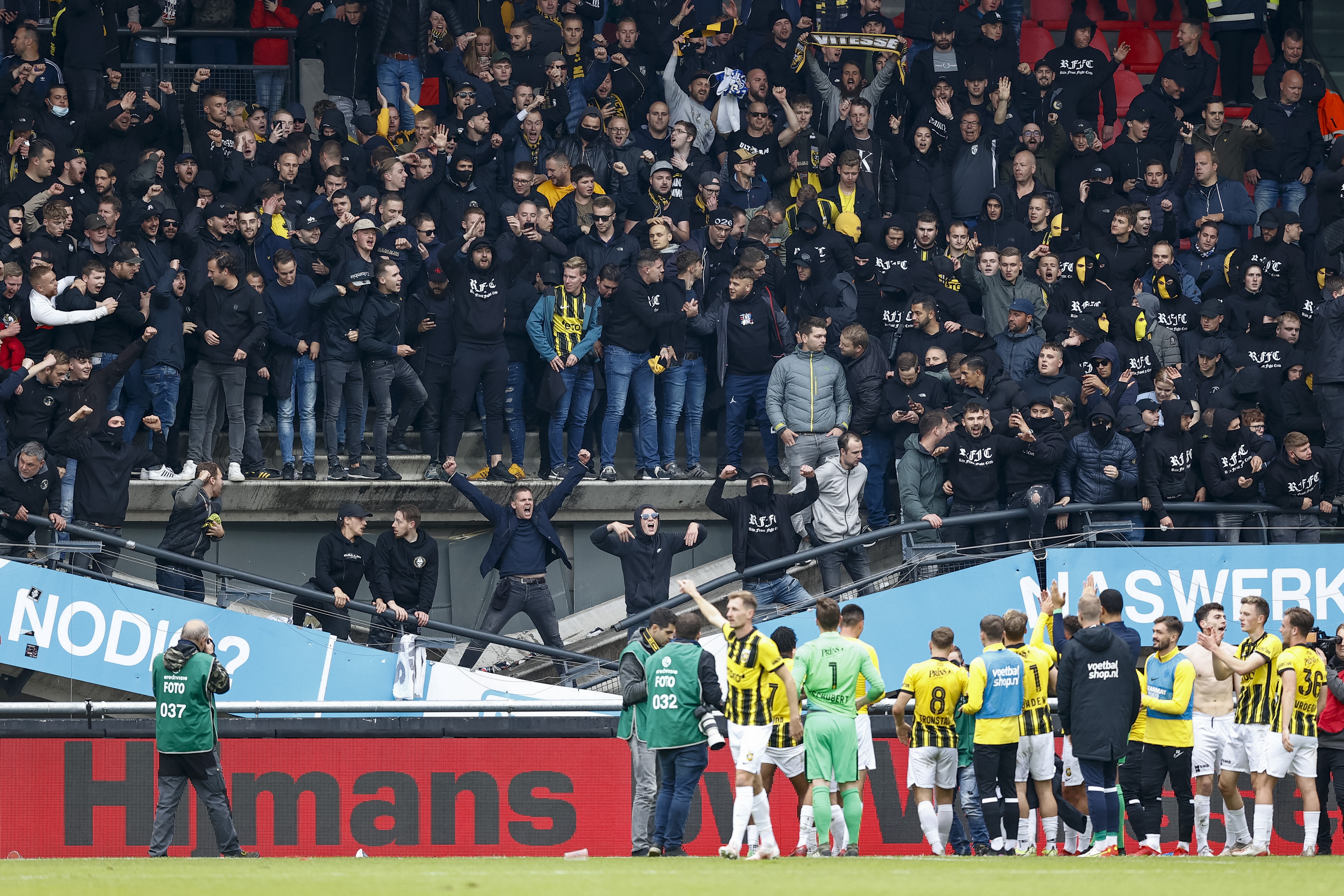 Vitesse Arnhem salute their supporters as they stand on a collapsed stand after the Dutch Eredivisie match between NEC Nijmegen and Vitesse Arnhem AT Goffertstadionin Nijmegen, on October 17, 2021. (Photo by Vincent Jannink / ANP / AFP) / Netherlands OUT