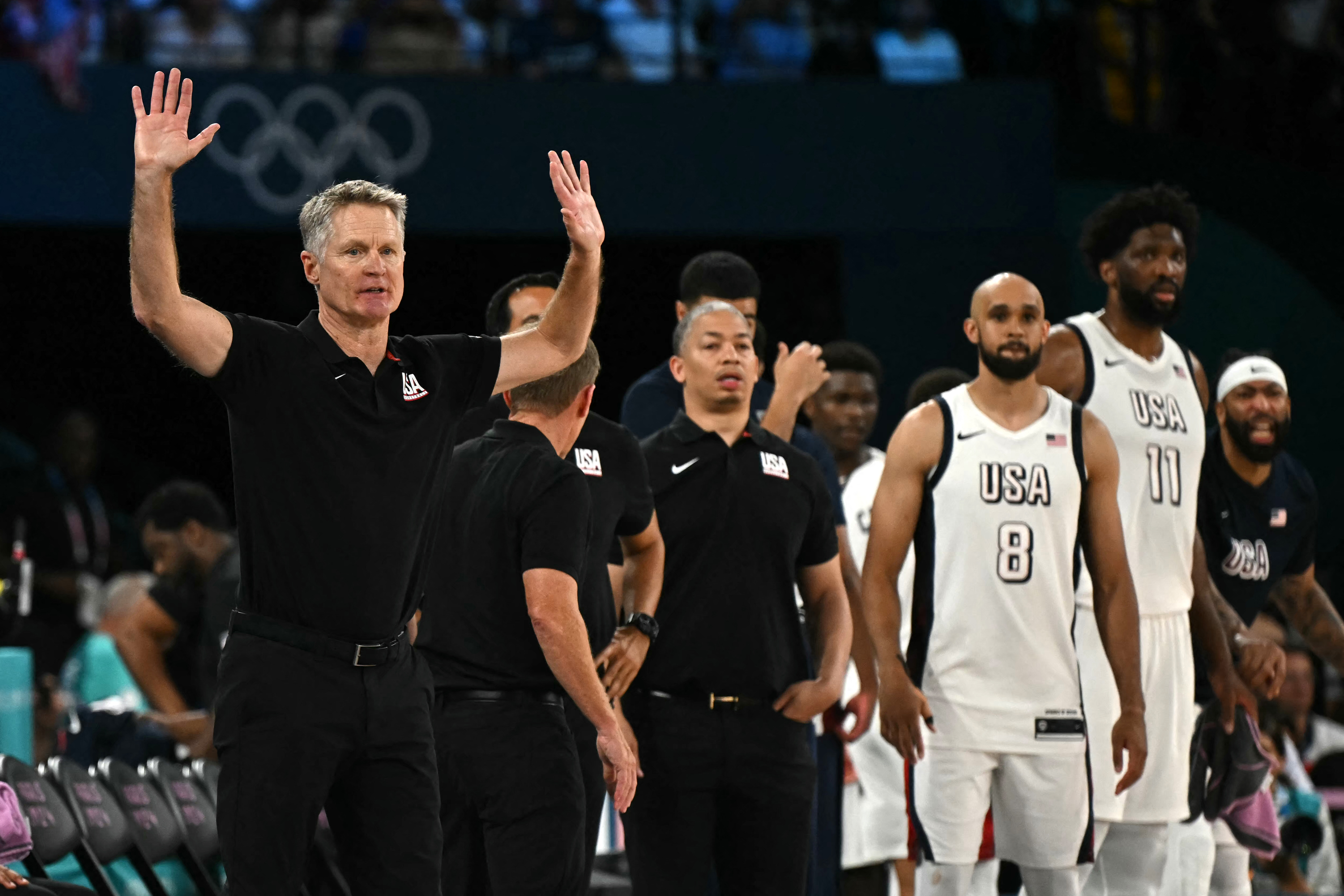 USA's coach Steve Kerr (L) reacts in the men's semifinal basketball match between USA and Serbia during the Paris 2024 Olympic Games at the Bercy Arena in Paris on August 8, 2024. (Photo by Paul ELLIS / AFP)