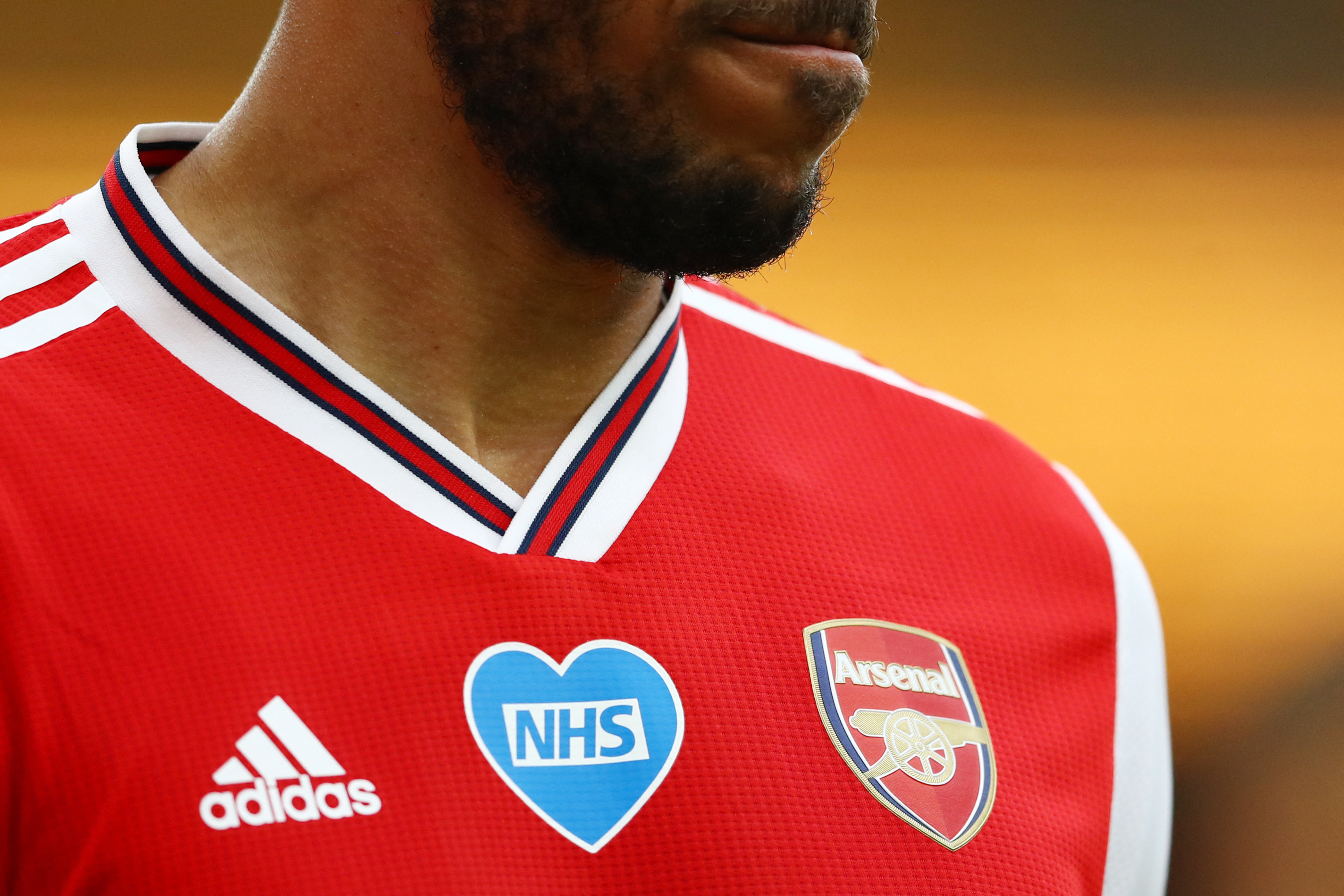 A picture shows a thanks to the NHS badge on the jersey of Arsenal's Gabonese