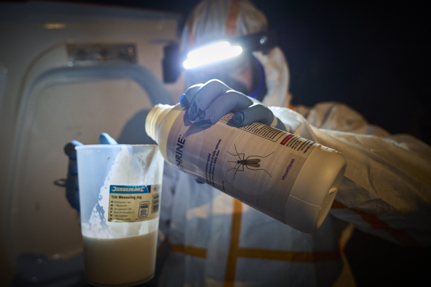An agent from a pest control company gets ready to carry out a mosquito control sequence
