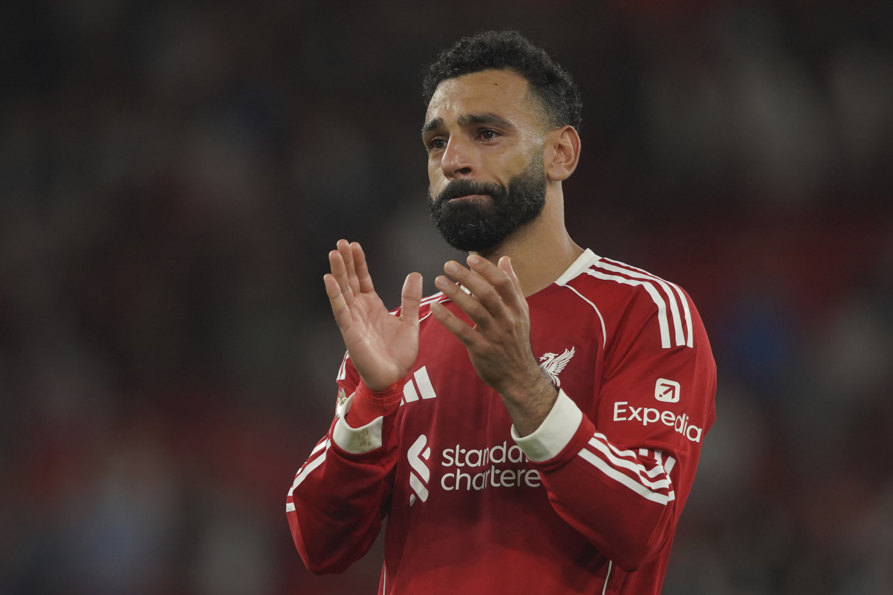 Liverpool's Mohamed Salah applauds at full time of the English Premier League soccer match between Liverpool and Bournemouth at Anfield stadium in Liverpool, England, Friday, Aug. 15, 2025. (AP Photo/Ian Hodgson)