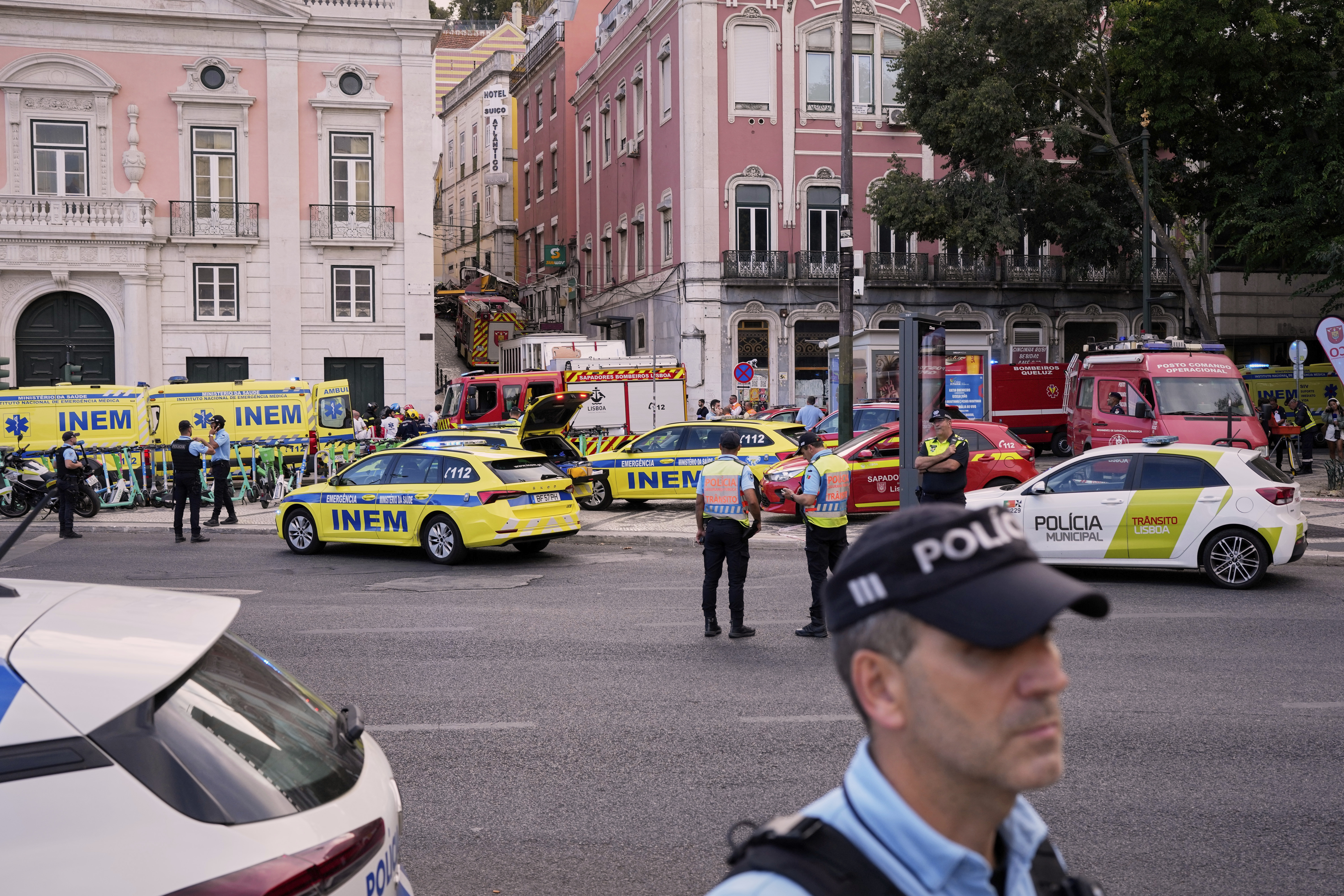 Emergency teams work at the site of a derailed electric streetcar in Lisbon, Portugal, Wednesday, Sept. 3, 2025. (AP Photo/Armando Franca)