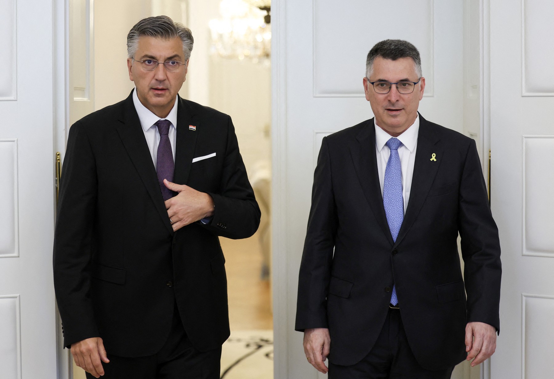 Croatia's Prime Minister Andrej Plenkovic (L) welcomes Israel's Minister of Foreign