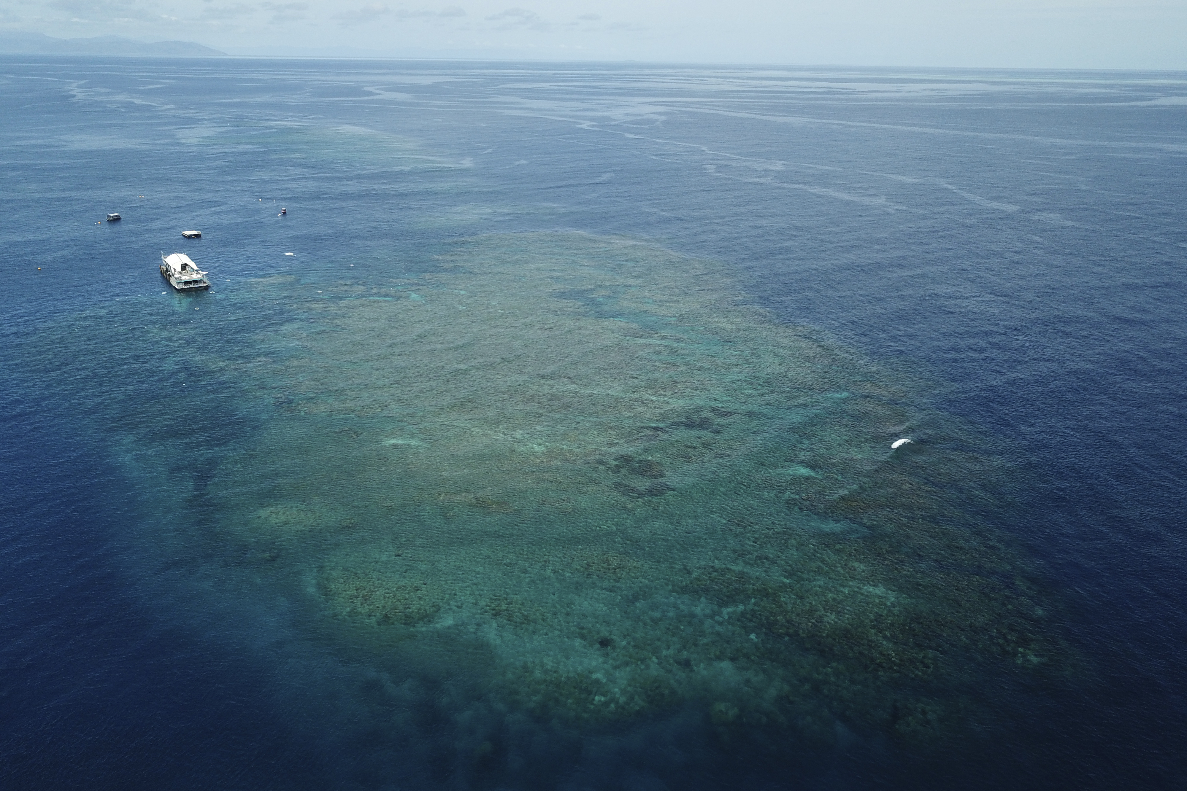 The Remoora pontoon, owned by Reef Magic, sits above a section of the Great Barrier Reef above Moore Reef in Gunggandji Sea Country off coast of Queensland in eastern Australia on Nov. 14, 2022. (AP Photo/Sam McNeil)