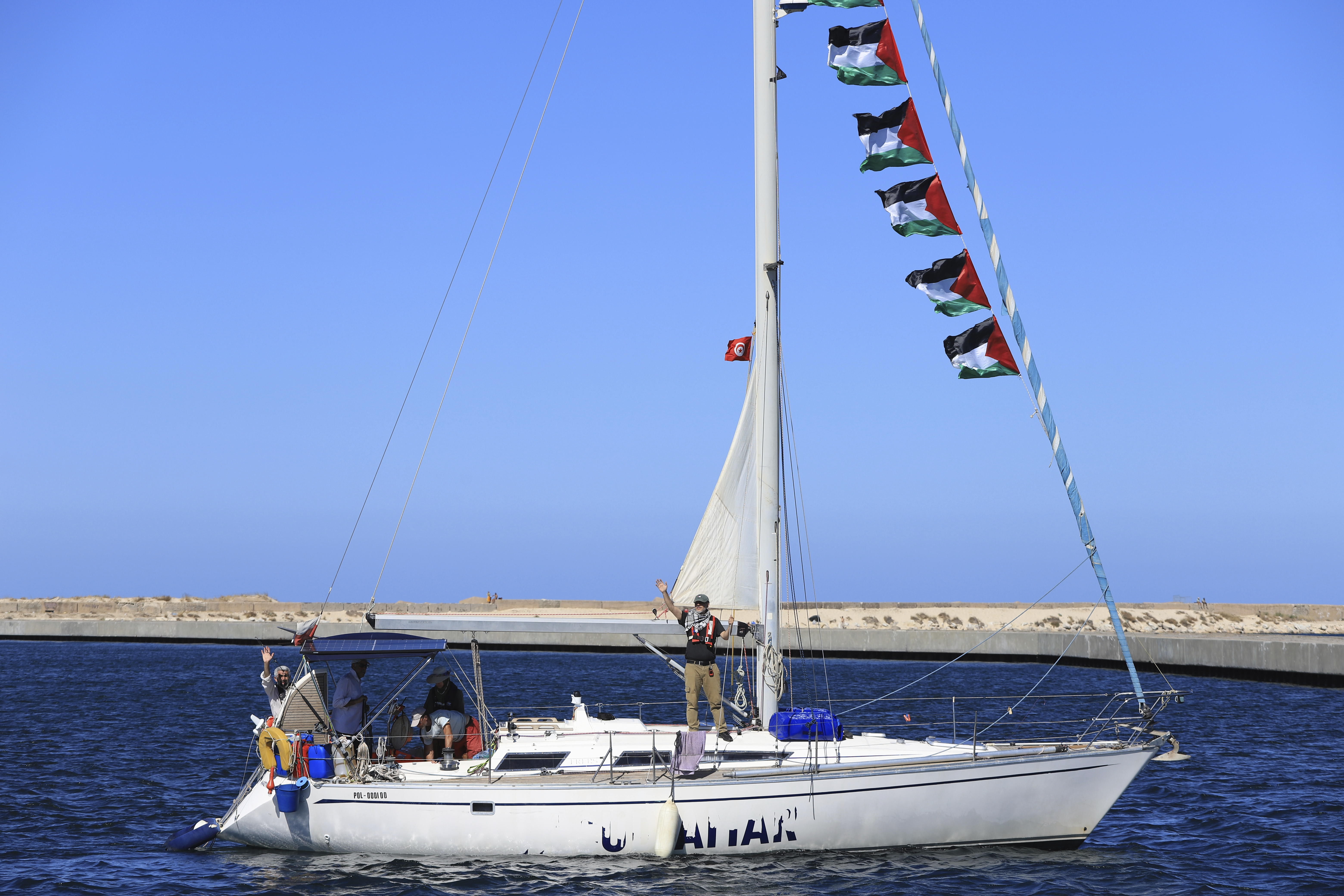 A boat that is part of the Global Sumud Flotilla departs to Gaza to deliver aid amidst Israel's blockade on the Palestinian territory, in the Tunisian port of Bizerte, Saturday, Sept. 13, 2025. (AP Photo/Anis Mili)