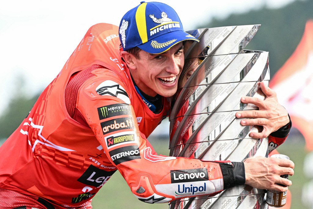 Ducati Lenovo Team's Spanish MotoGP rider Marc Marquez celebrates with the trophy