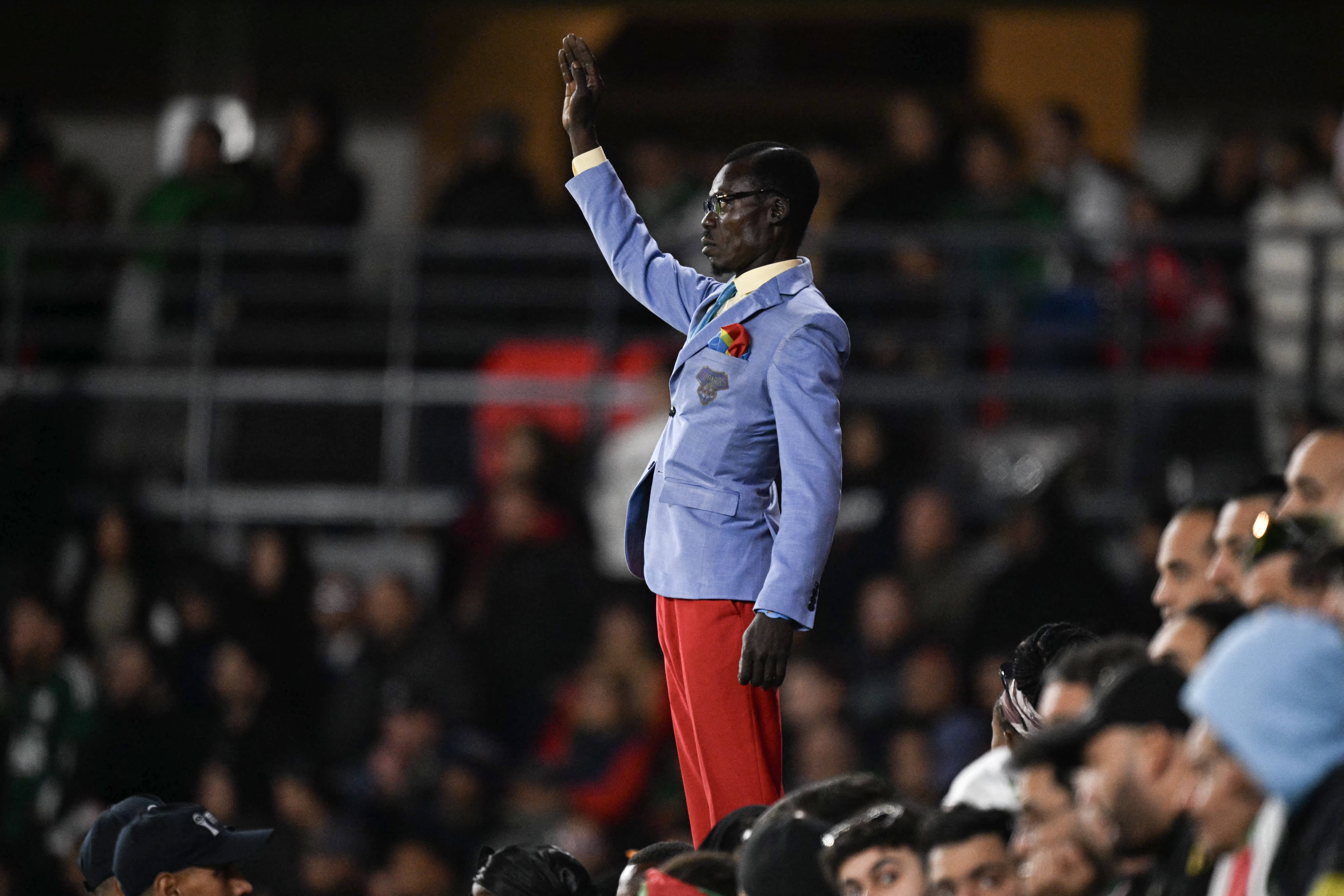 Democratic Republic of Congo's supporter Michel Kuka Mboladinga, pays tribute t