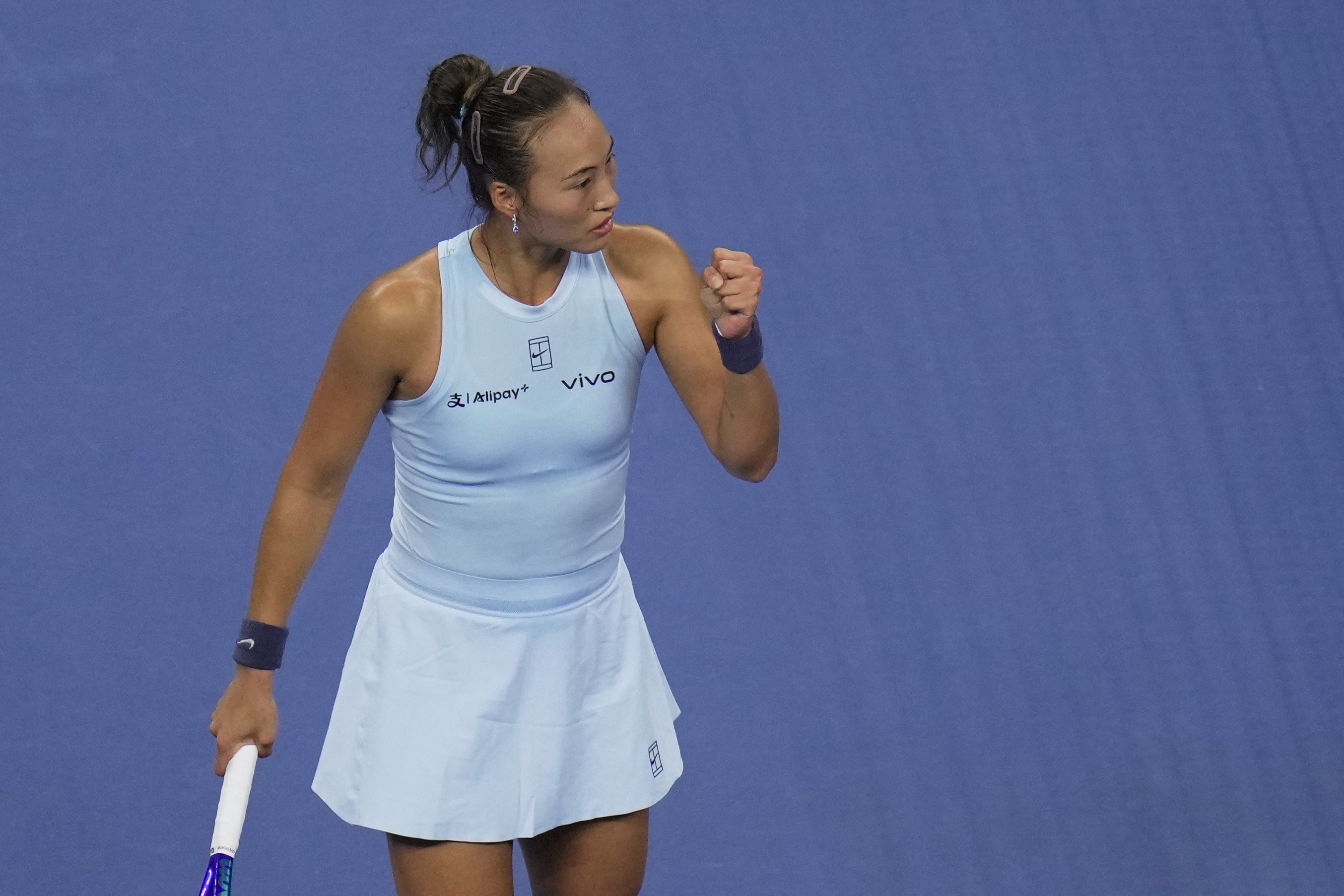 Zheng Qinwen, of China reacts after scoring a point against Emiliana Arango, of Columbia during the women's singles match for the China Open tennis tournament, at the National Tennis Center, in Beijing, Saturday, Sept. 27, 2025. (AP Photo/Andy Wong)