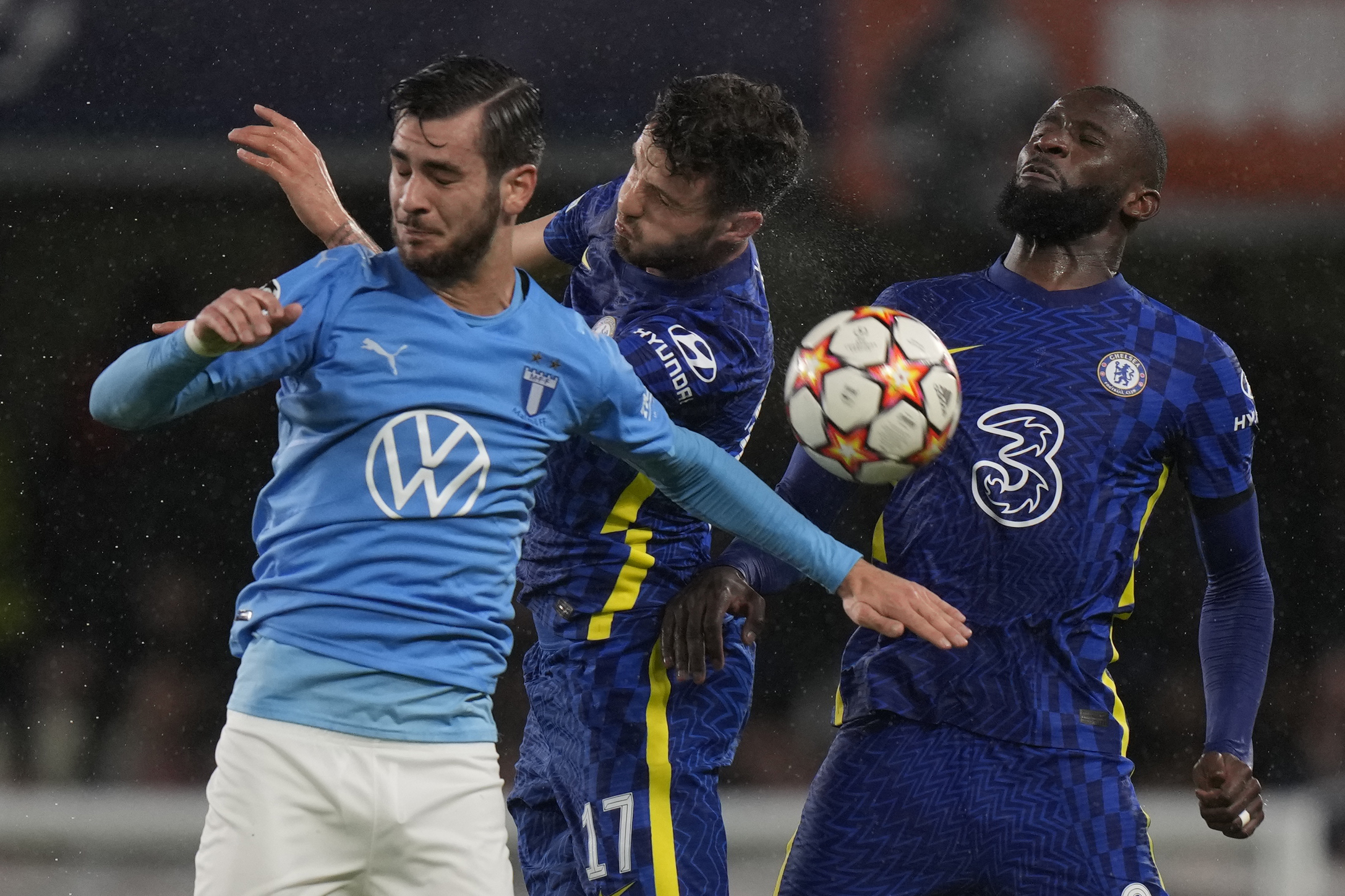 Malmo's Adi Nalić, left, jumps for a header with Chelsea's Saul during the Champions League group H soccer match between Chelsea and Malmo at the Stamford Bridge stadium in London, Wednesday, Oct. 20, 2021. (AP Photo/Alastair Grant)