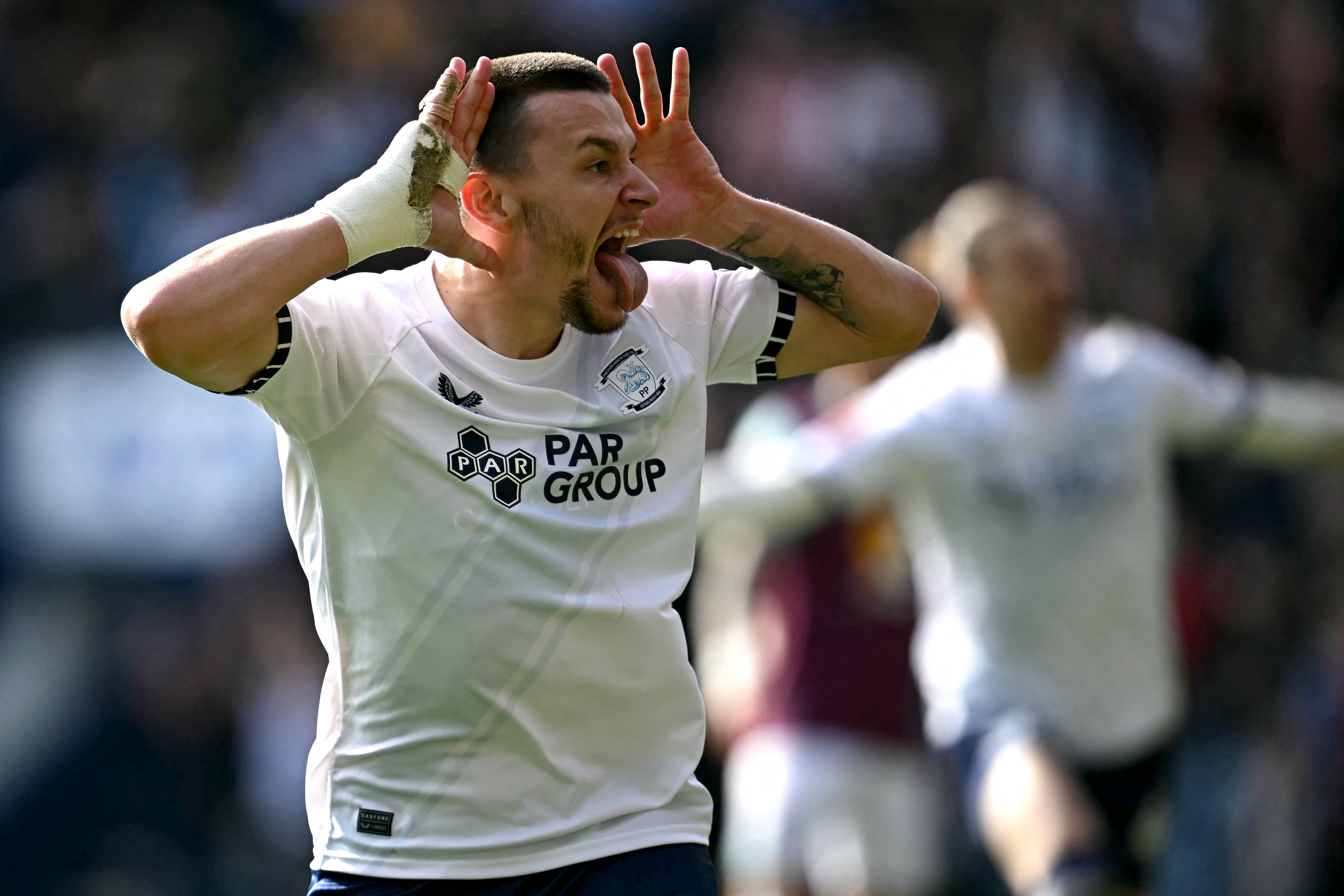 Preston's Montenegrin striker #28 Milutin Osmajic Osmajić celebrates scoring the team's second goal during the English FA Cup fifth round football match between Preston North End and Burnley at Deepdale stadium in Preston, north-west England