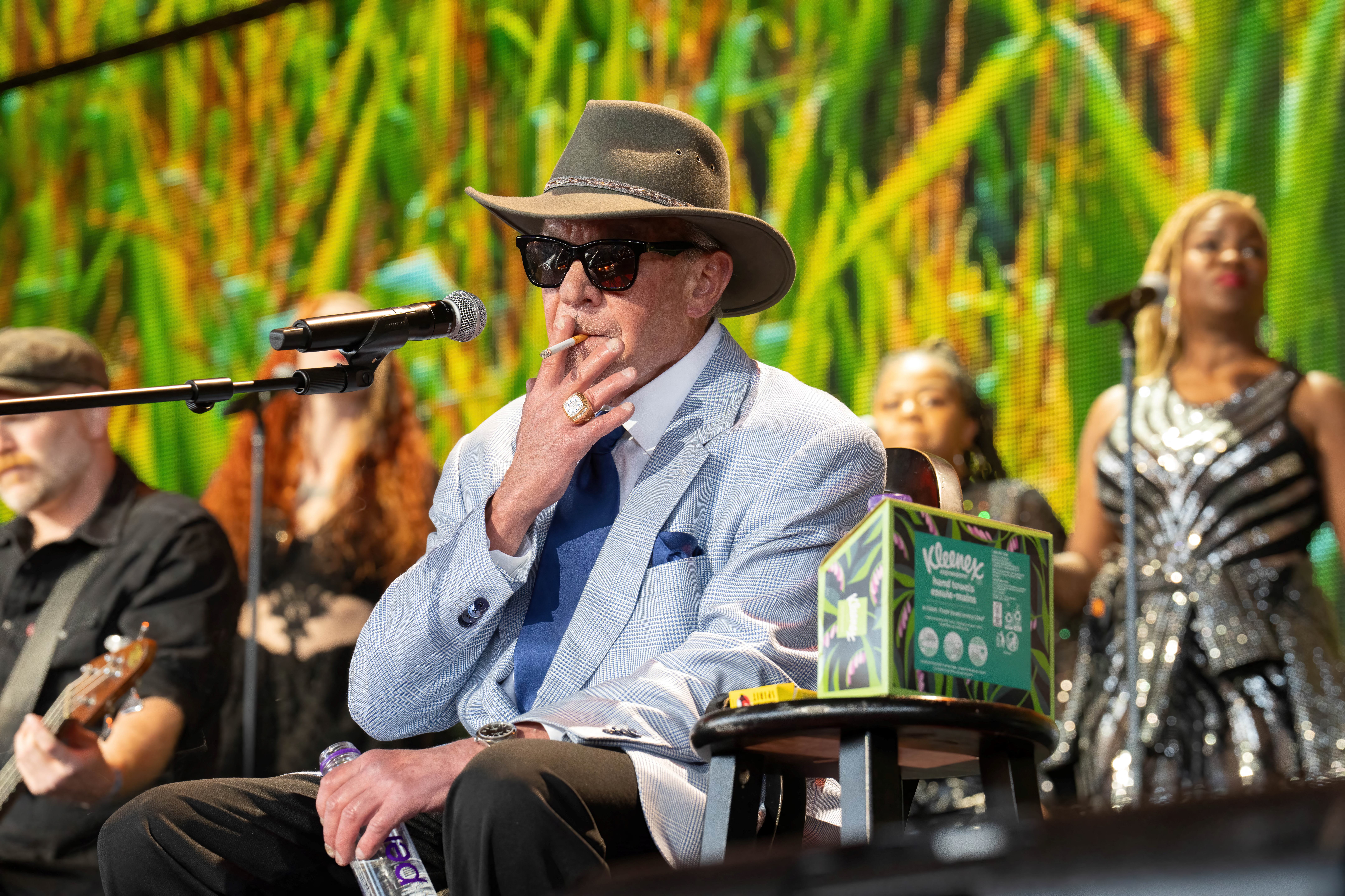 US businessman Jim Irsay smokes on stage during the Farm Aid Music Festival at the Ruoff Music Center on September 23, 2023 in Noblesville, Indiana. (Photo by SUZANNE CORDEIRO / AFP)
