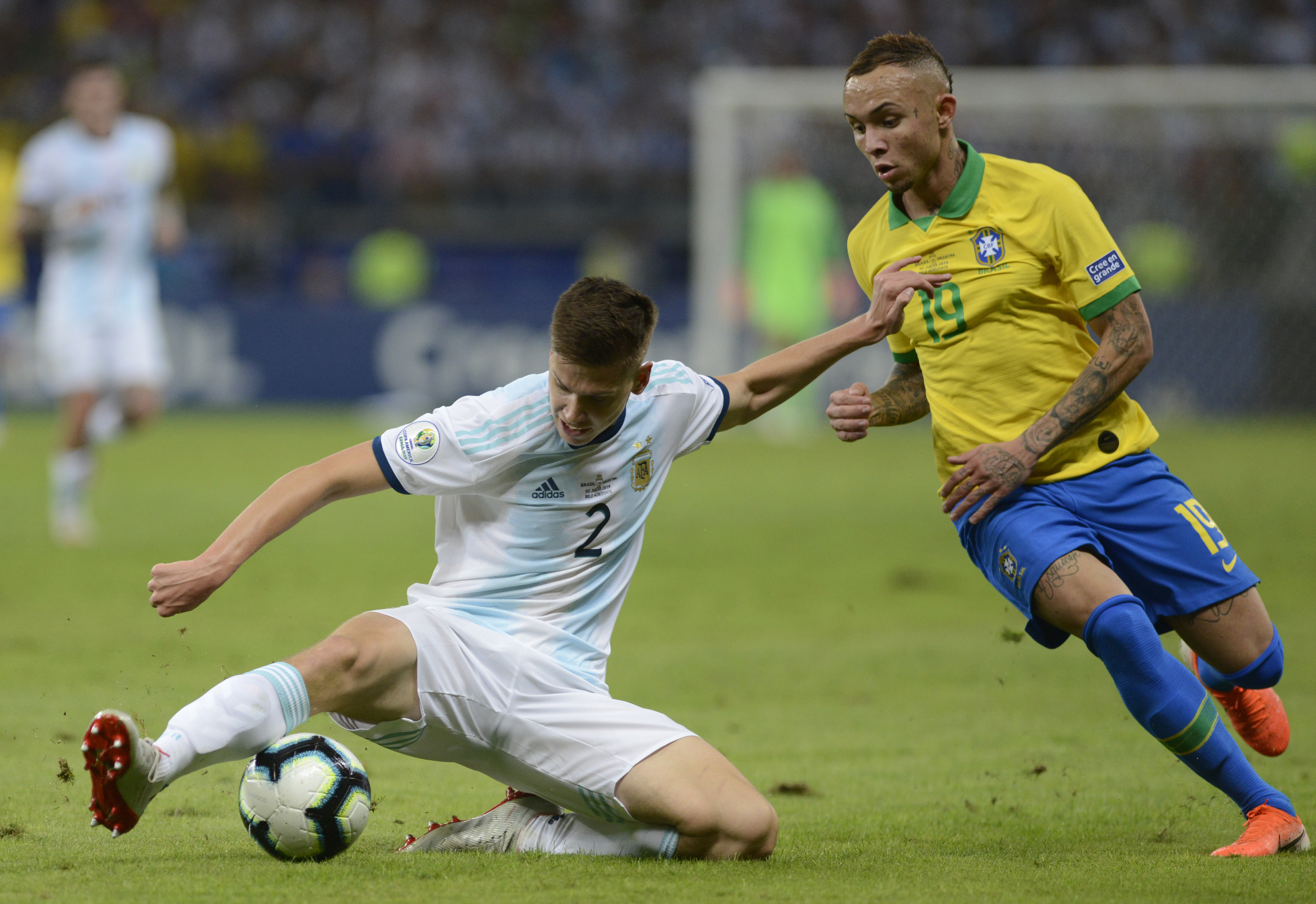 Argentina's Juan Foyth, left, fights for the ball with Brazil's Everton during a Copa America semifinal soccer match at Mineirao stadium in Belo Horizonte, Brazil, Tuesday, July 2, 2019. (AP Photo/Eugenio Savio)
