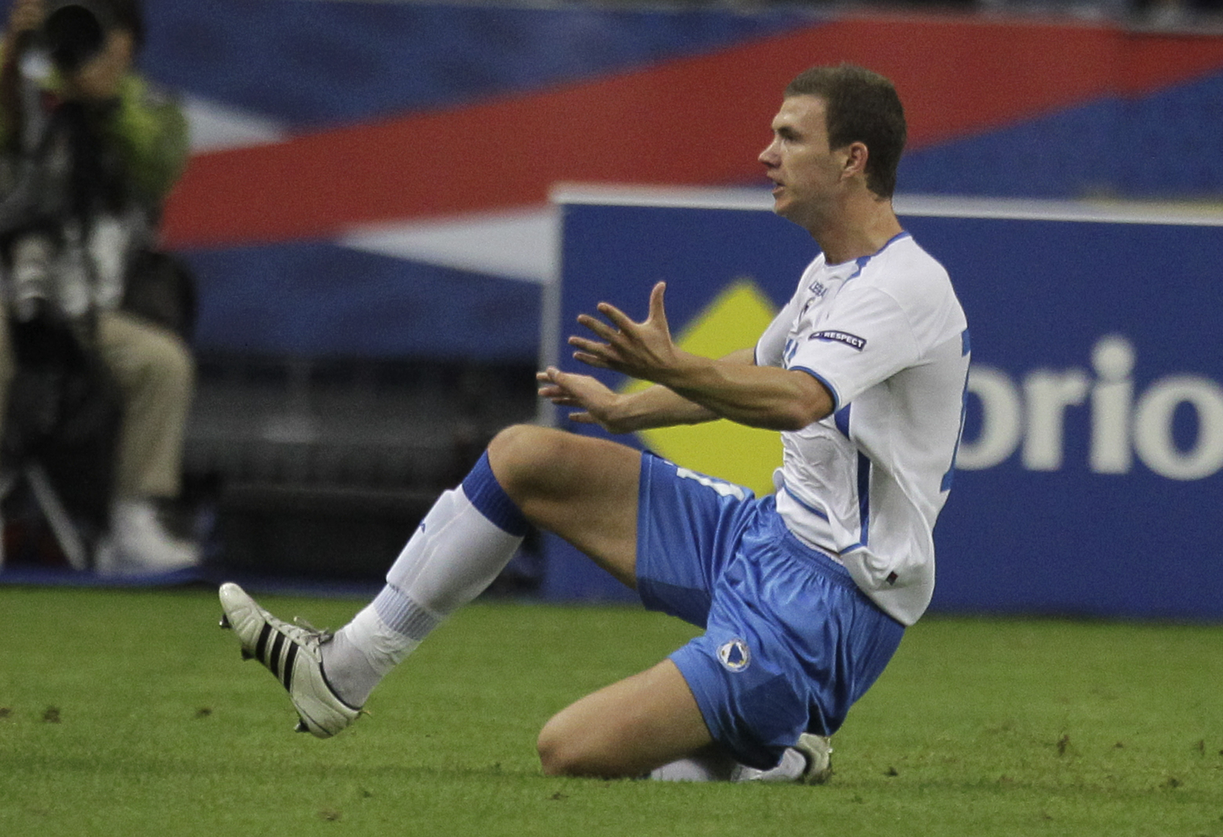 Bosnia's Edin Dzeko, celebrates the opening goal during a Euro 2012 Group D qualifying soccer match France against Bosnia-Herzegovina, at Stade de France stadium in Saint Denis, near Paris, Tuesday, Oct. 11, 2011. (AP Photo/Michel Euler)