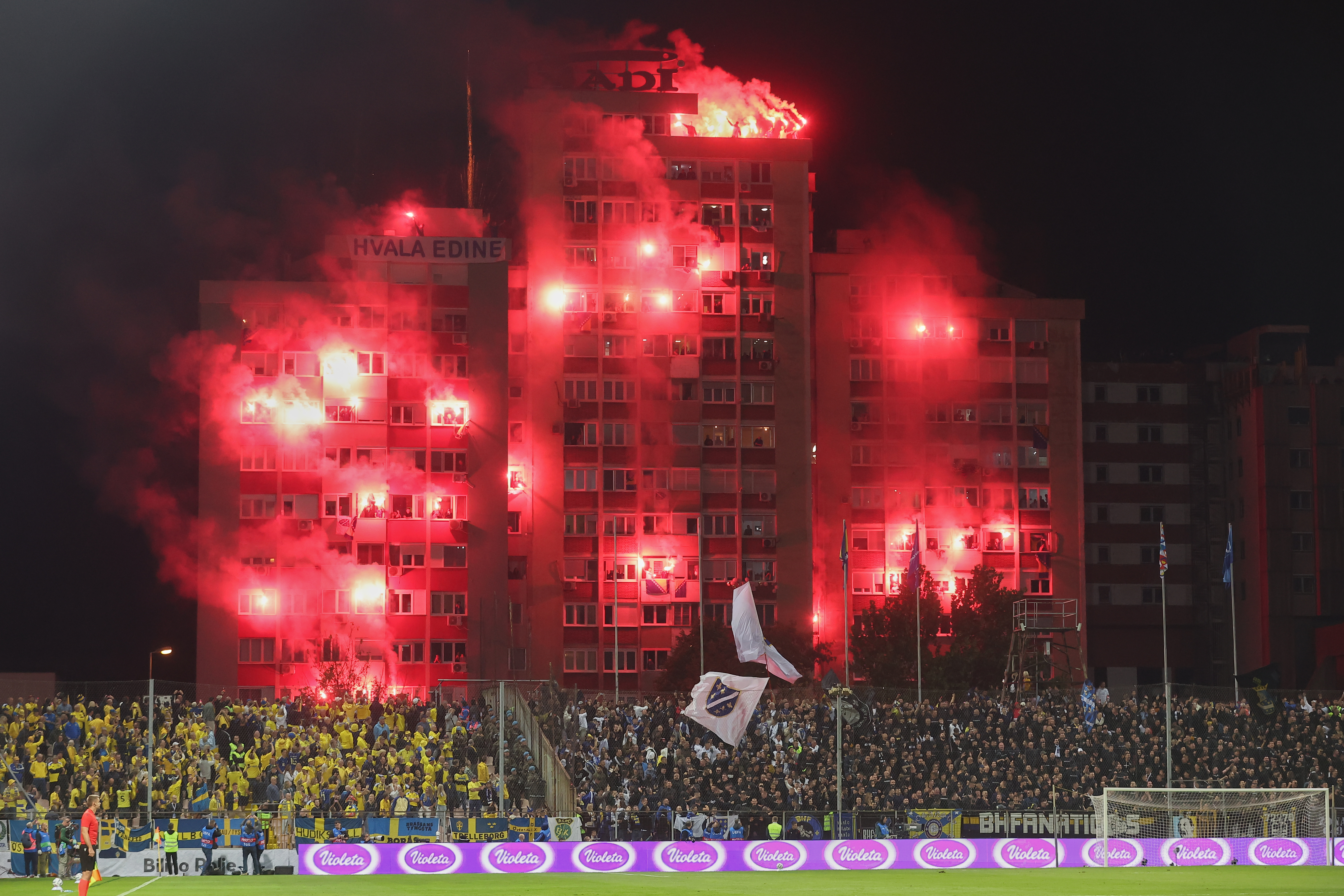 Fans shoot fireworks from a bulding during the Nations League soccer match between Bosnia and Herzegovina and Sweden in Zenica, Friday, Oct. 2, 2026. (AP Photo/Armin Durgut)