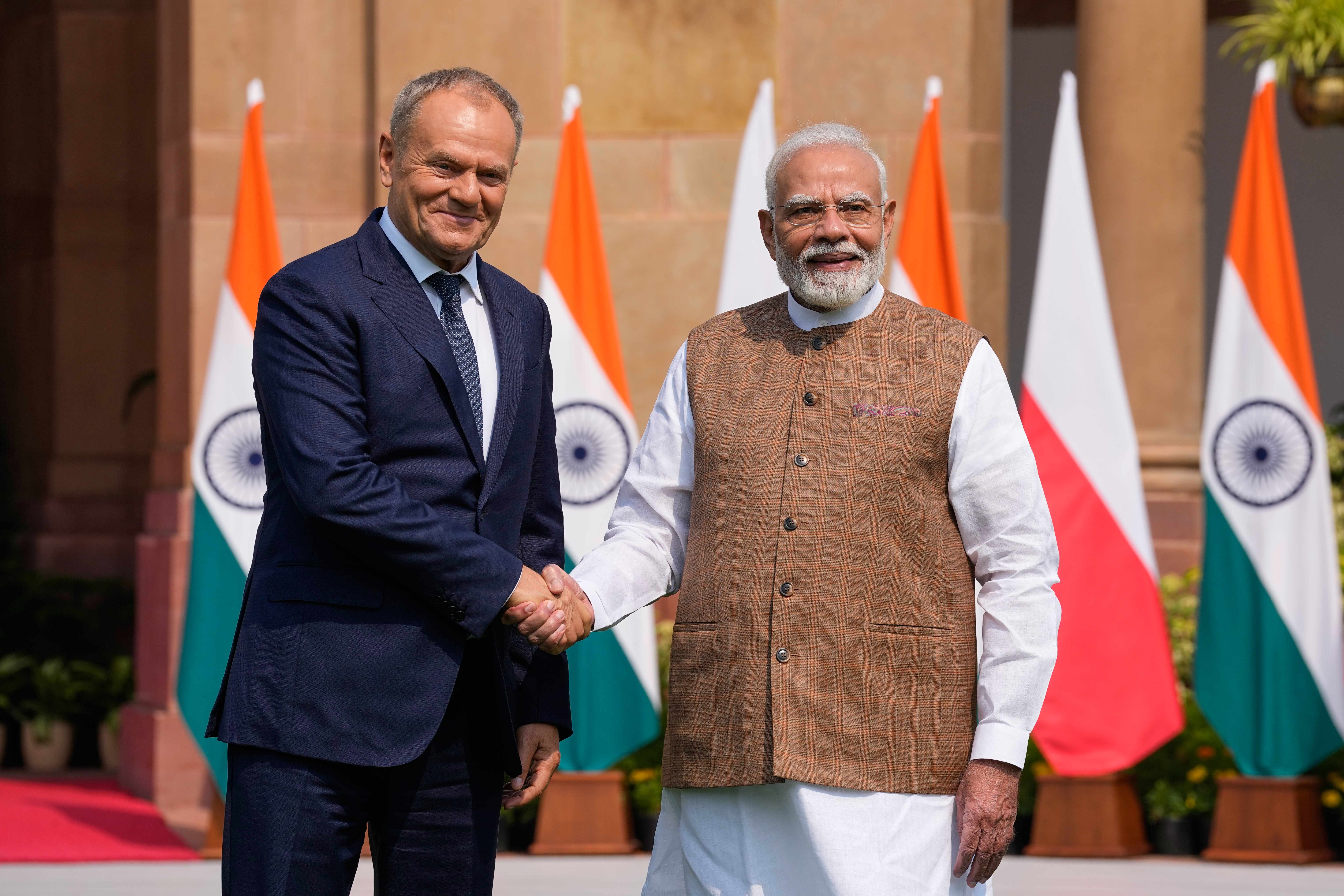 Indian Prime Minister Narendra Modi, right, shakes hand with his Polish counterpart Donald Tusk before their meeting in New Delhi, Thursday, Oct. 22, 2026. (AP Photo/Manish Swarup)