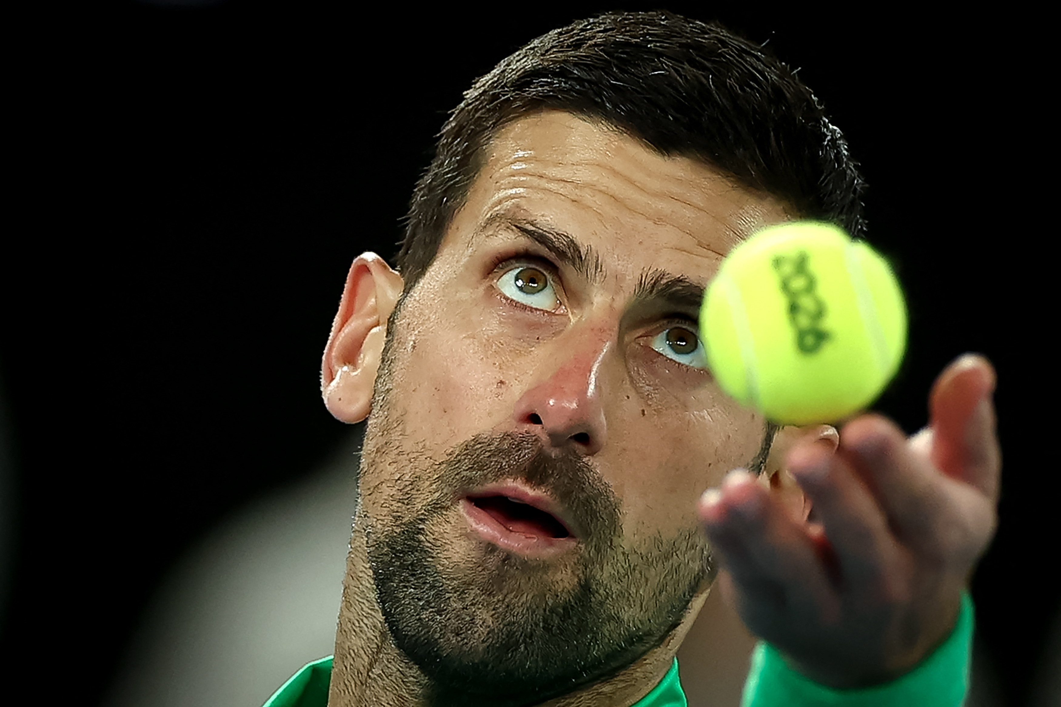 Serbia's Novak Djokovic prepares to serve against Spain's Carlos Alcaraz during