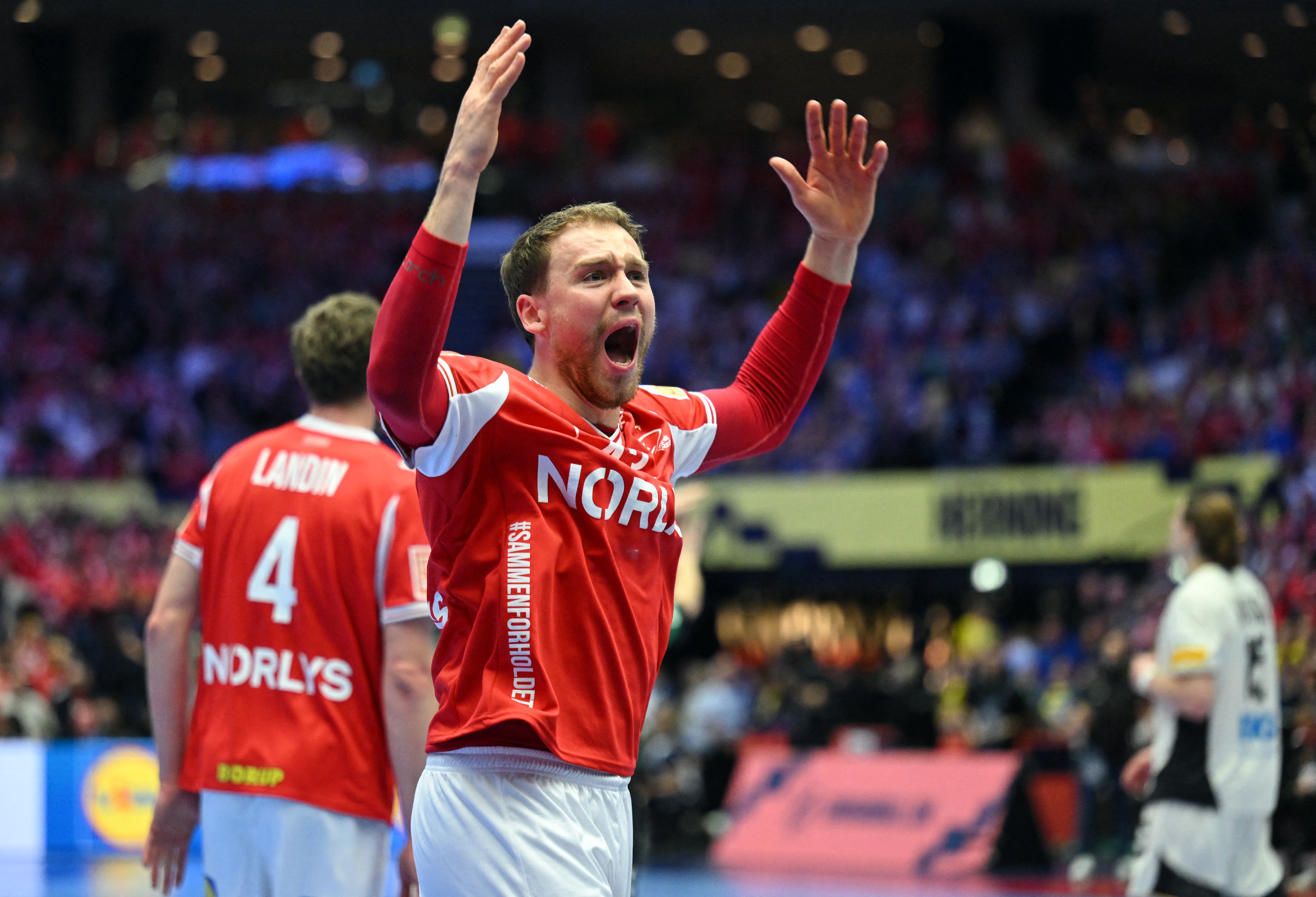 Denmark's centre back #43 Simon Pytlick celebrates during the Men's EHF Euro 2026 final handball match Denmark vs Germany in Herning, Denmark, on February 1, 2026. (Photo by Jonathan Nackstrand / AFP)