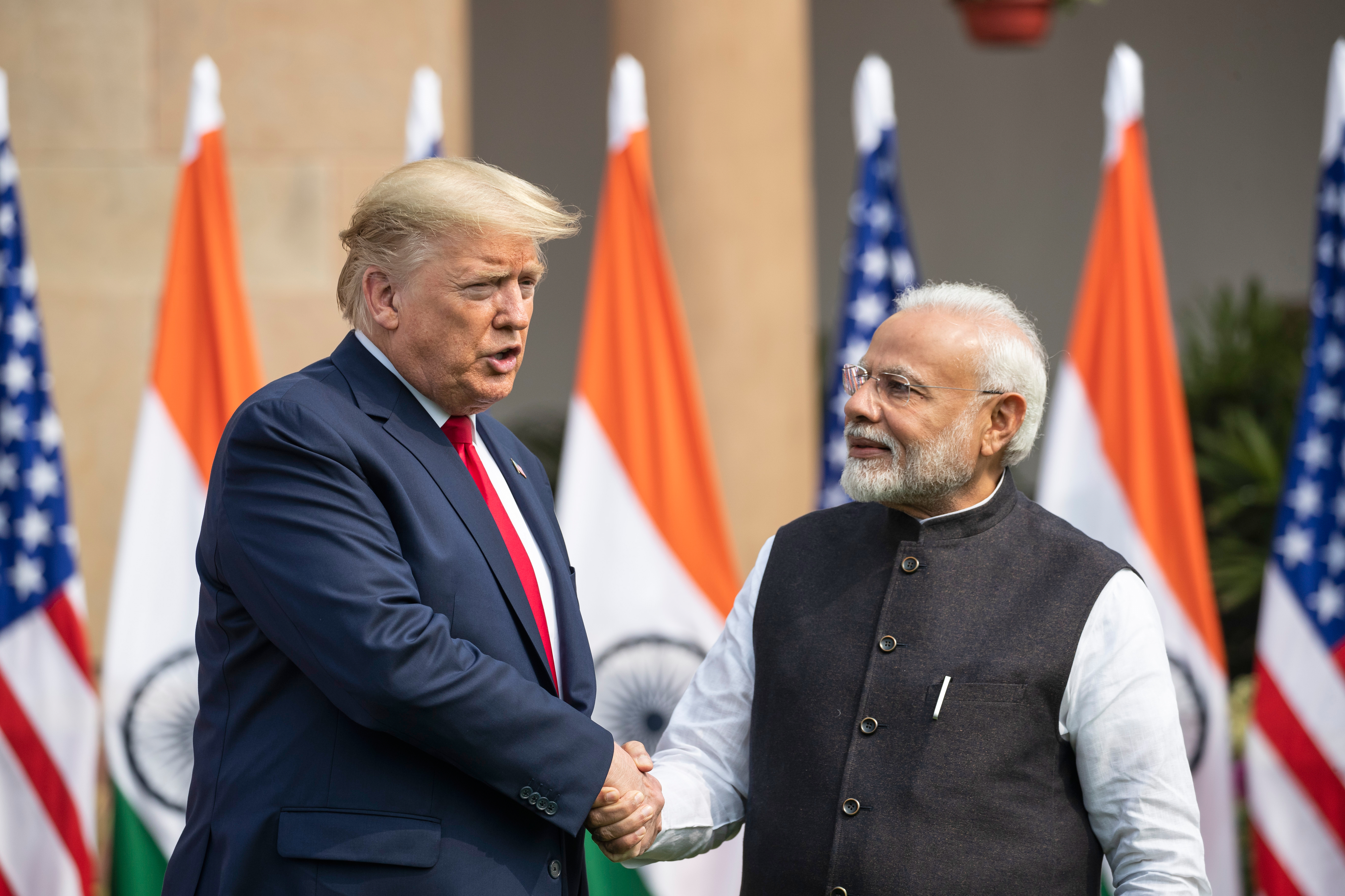 FILE-U.S. President Donald Trump and Indian Prime Minister Narendra Modi shake hands before their meeting at Hyderabad House, Feb. 25, 2020, in New Delhi, India. (AP Photo/Alex Brandon, file)