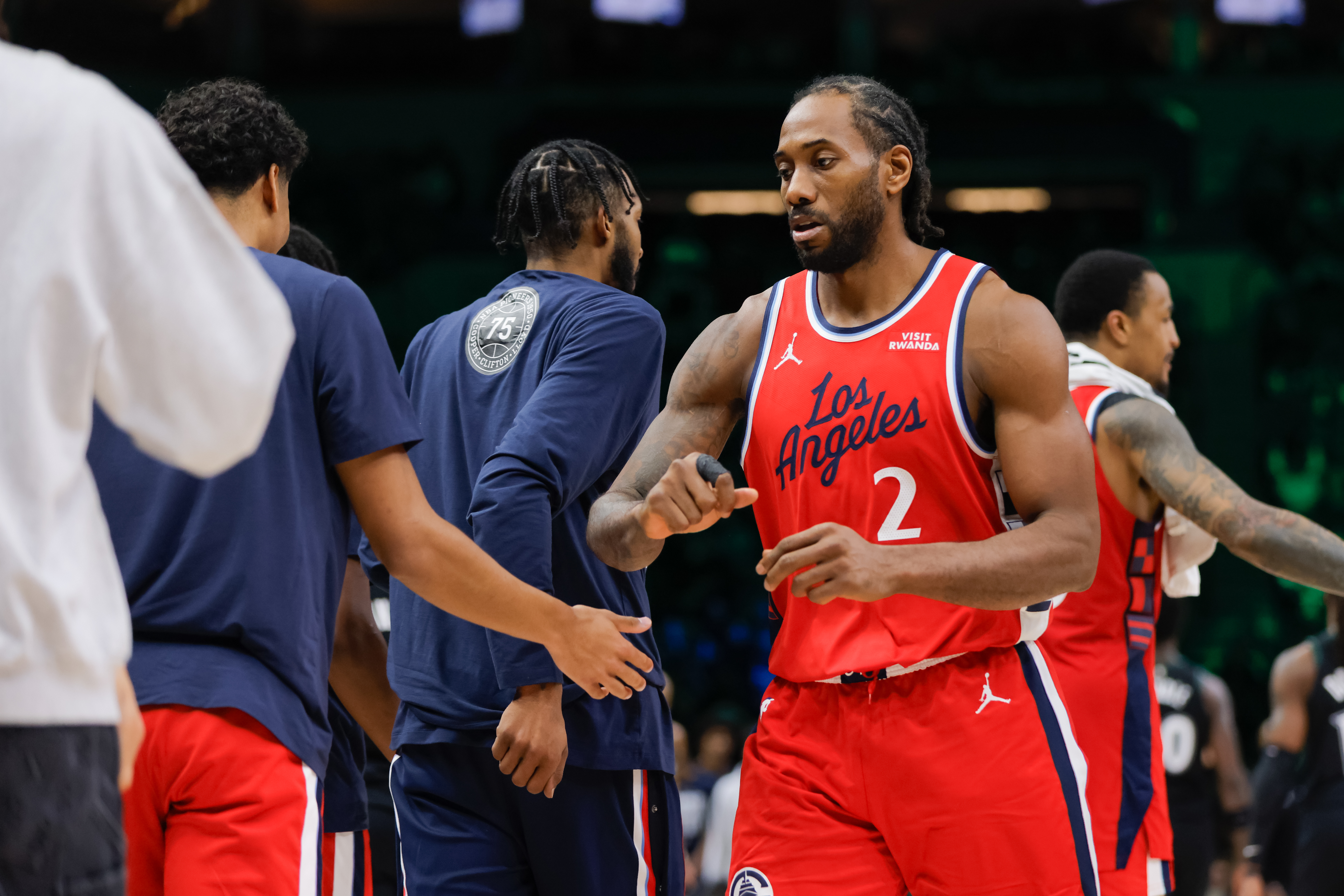 Los Angeles Clippers forward Kawhi Leonard (2) is congratulated after scoring during the second half of an NBA basketball game against the Minnesota Timberwolves, Sunday, Feb. 8, 2026, in Minneapolis. (AP Photo/Bailey Hillesheim)