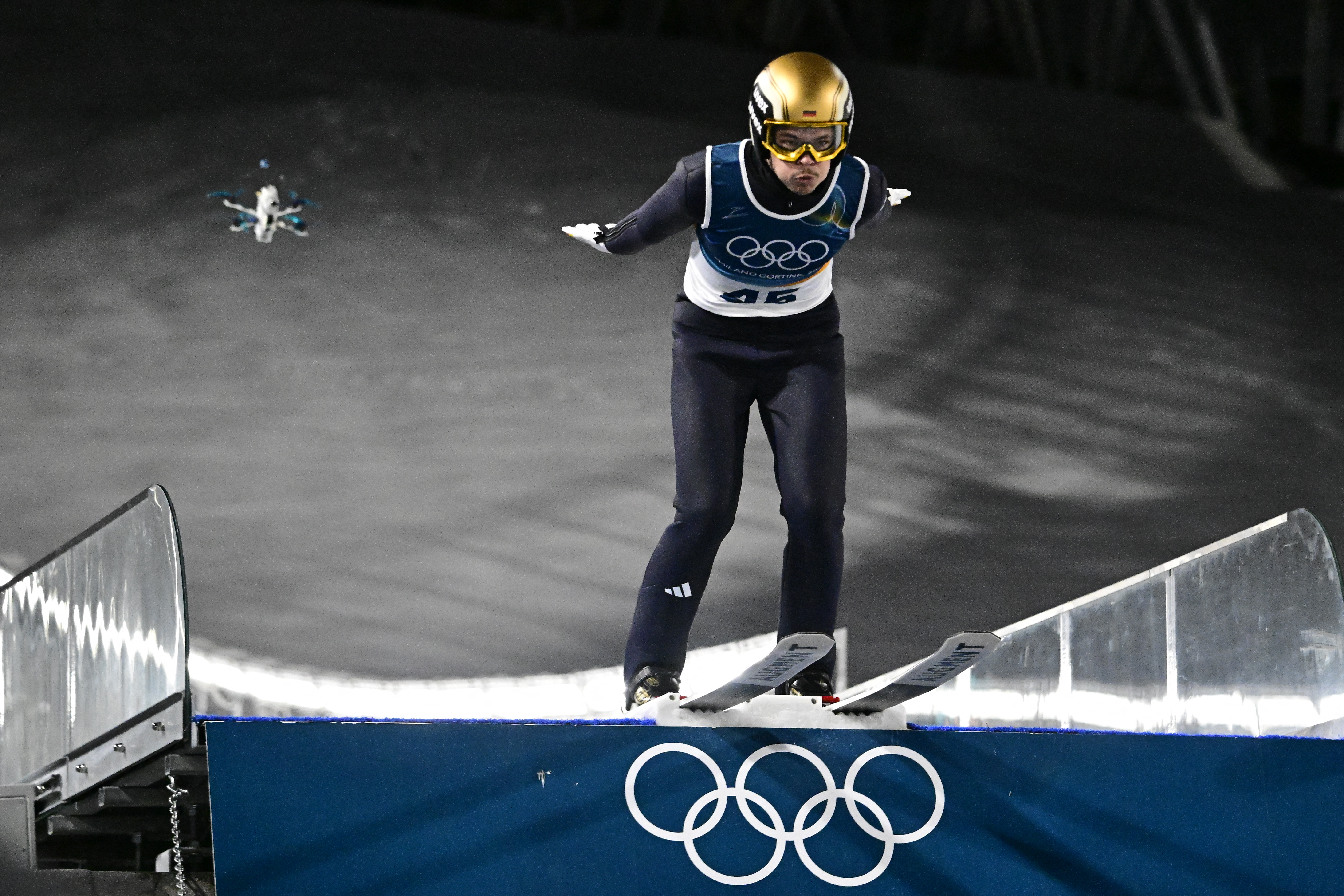 Germany's jumps during the men's ski jumping normal hill individual 1st round of the Milano Cortina 2026 Winter Olympic Games at Predazzo Ski Jumping Stadium in Predazzo (Val di Fiemme), on February 9, 2026. (Photo by Tobias SCHWARZ / AFP)