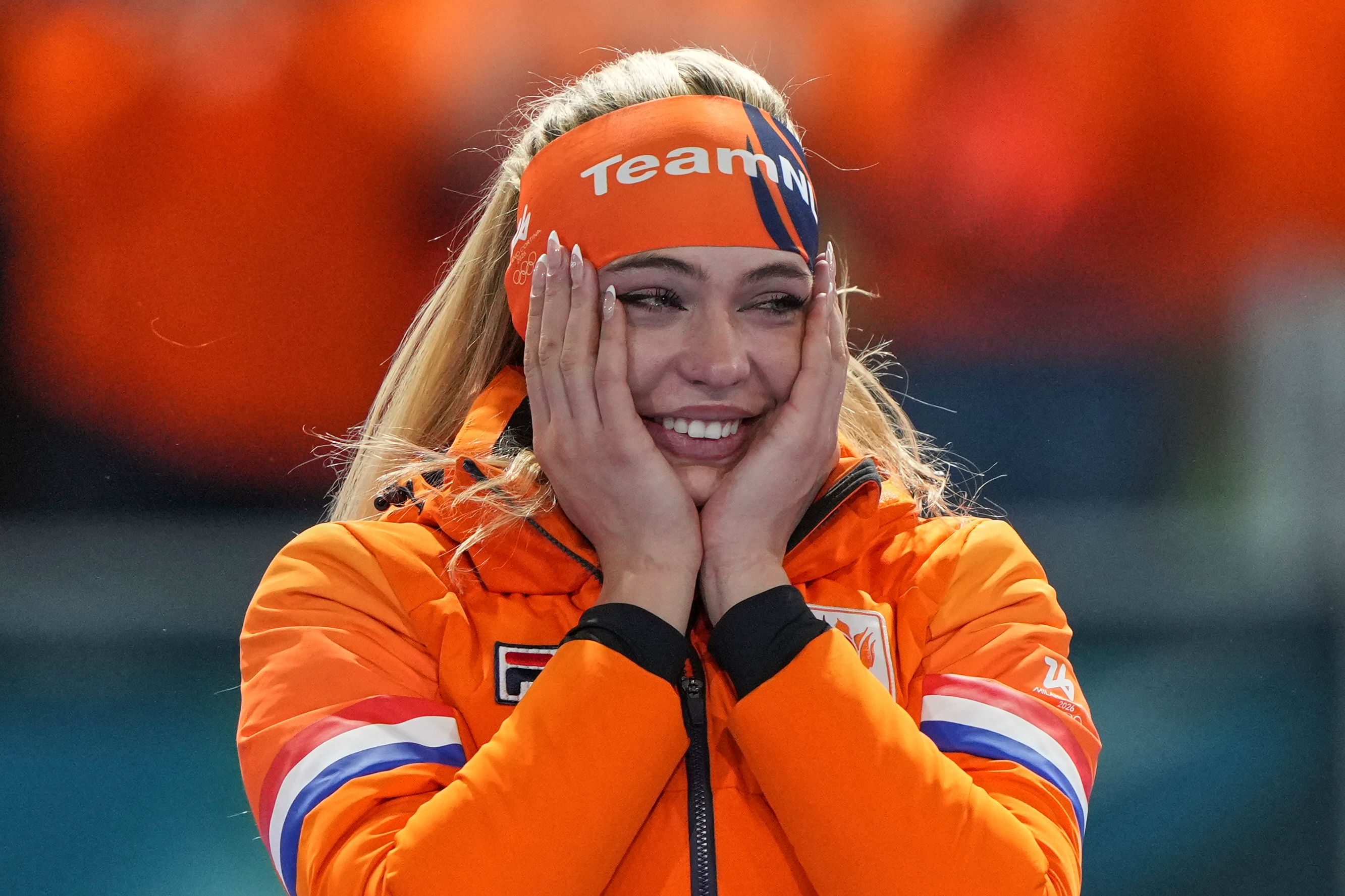 Gold medallist Jutta Leerdam of the Netherlands reacts on the podium of the women's 1,000 meters speedskating race at the 2026 Winter Olympics, in Milan, Italy, Monday, Feb. 9, 2026. (AP Photo/Antonio Calanni)