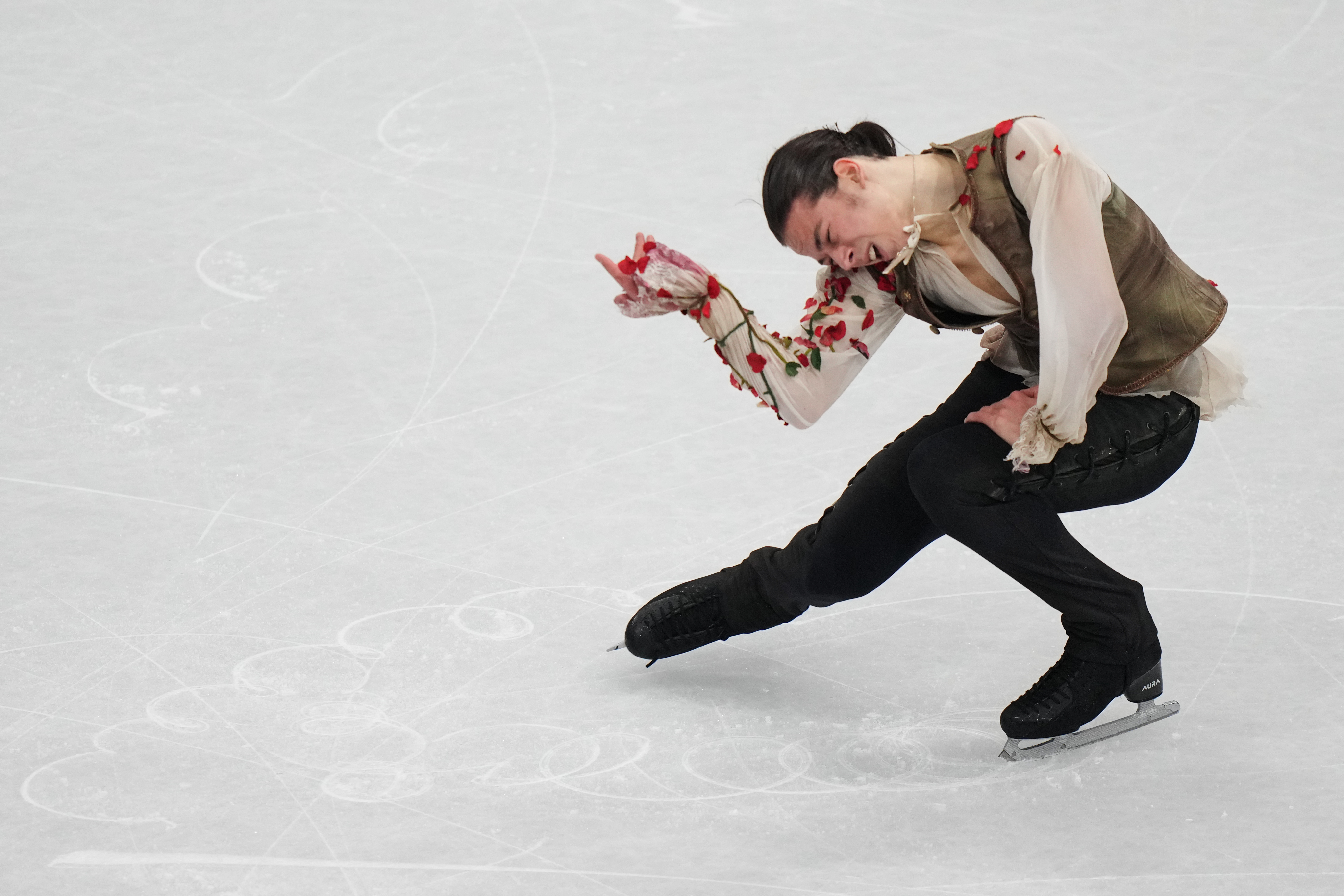 Petr Gumennik of Individual Neutral Athletes competes during the men's figure skating short program at the 2026 Winter Olympics, in Milan, Italy, Tuesday, Feb. 10, 2026. (AP Photo/Stephanie Scarbrough)