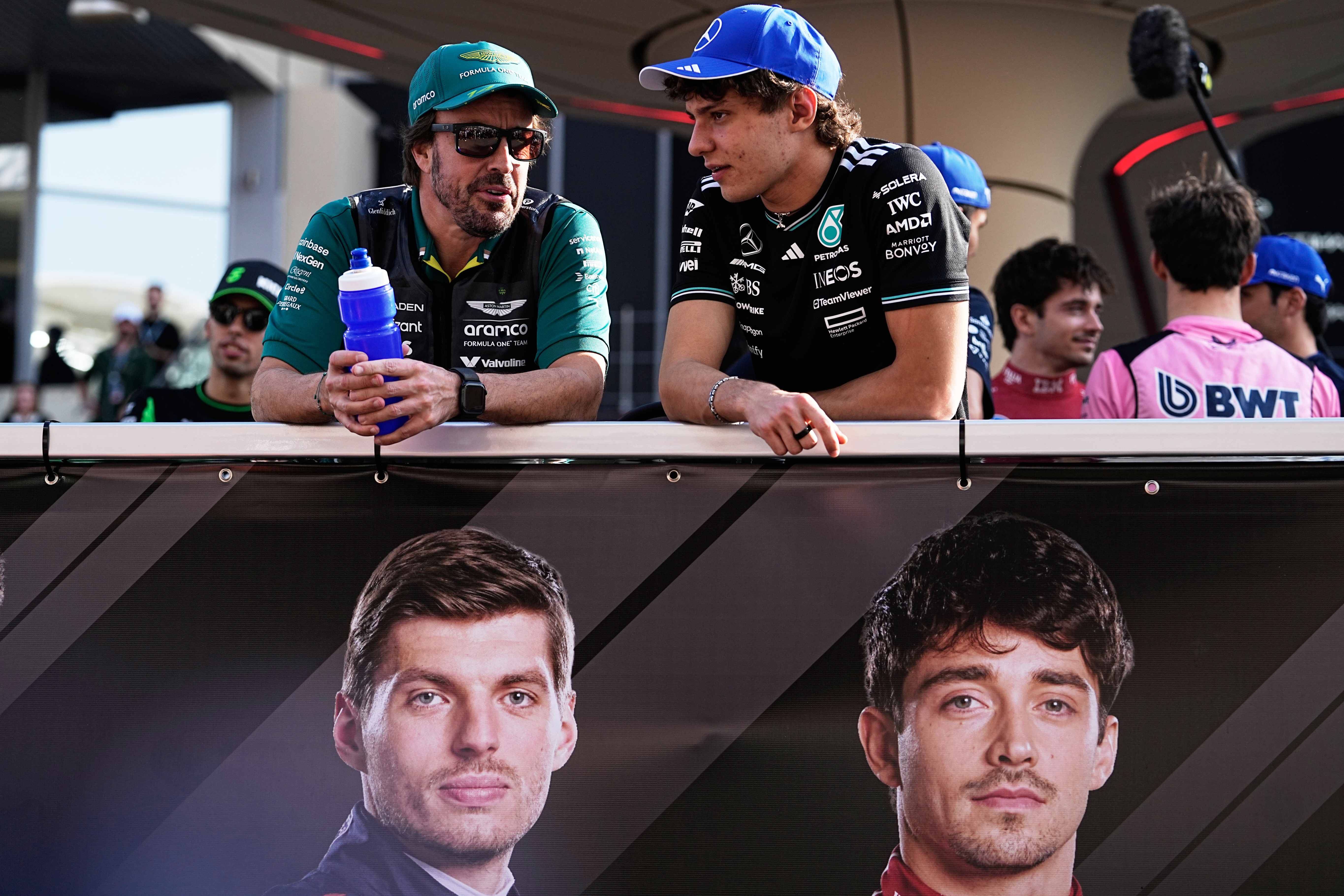 Aston Martin driver Fernando Alonso of Spain, left, and Mercedes driver Andrea Kimi Antonelli of Italy attend the drivers parade ahead of the Formula One Abu Dhabi Grand Prix at the Yas Marina Circuit in Abu Dhabi, UAE, Sunday, Dec. 7, 2025. (AP Photo/Fat