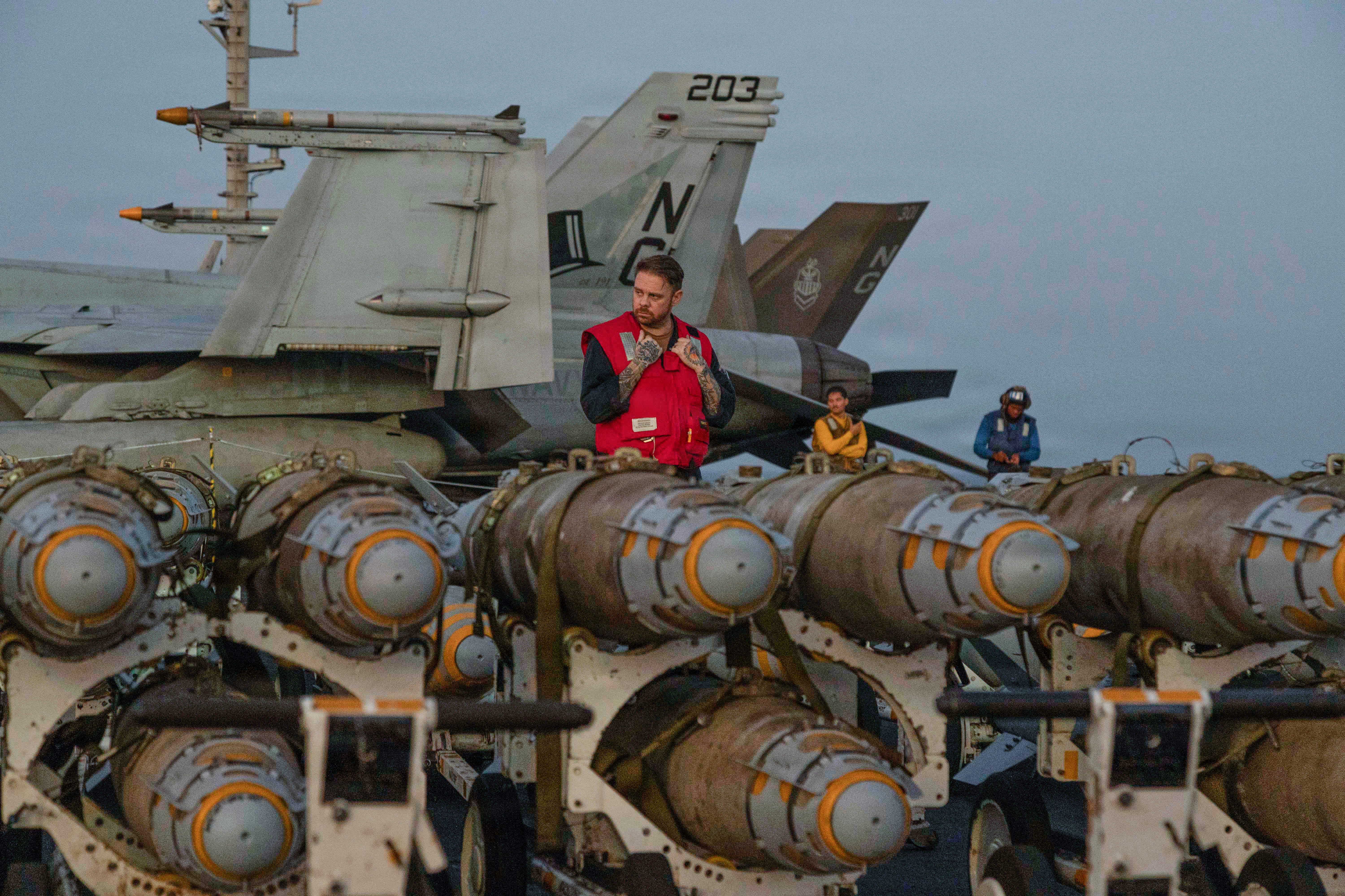 This image provided by U.S. Central Command shows Navy sailors transferring ordnance on the flight deck of Nimitz-class aircraft carrier USS Abraham Lincoln (CVN 72) on Friday, Feb. 27, 2026. (U.S. Navy via AP)