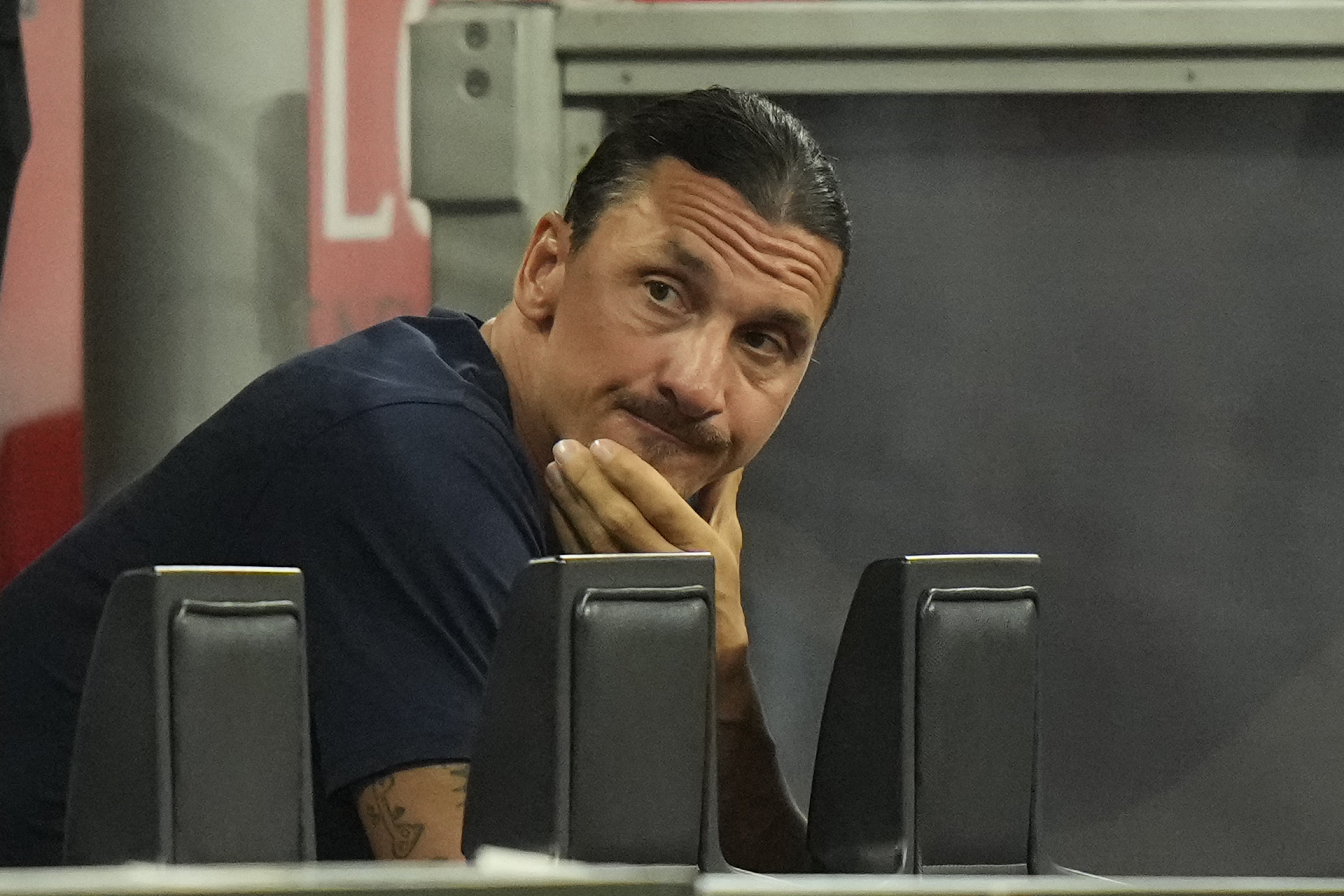 AC Milan's Zlatan Ibrahimovic reacts as he watches play during a Serie A soccer match between AC Milan and Bologna at the San Siro stadium in Milan, Italy, Saturday, Aug. 27, 2022. (AP Photo/Luca Bruno)