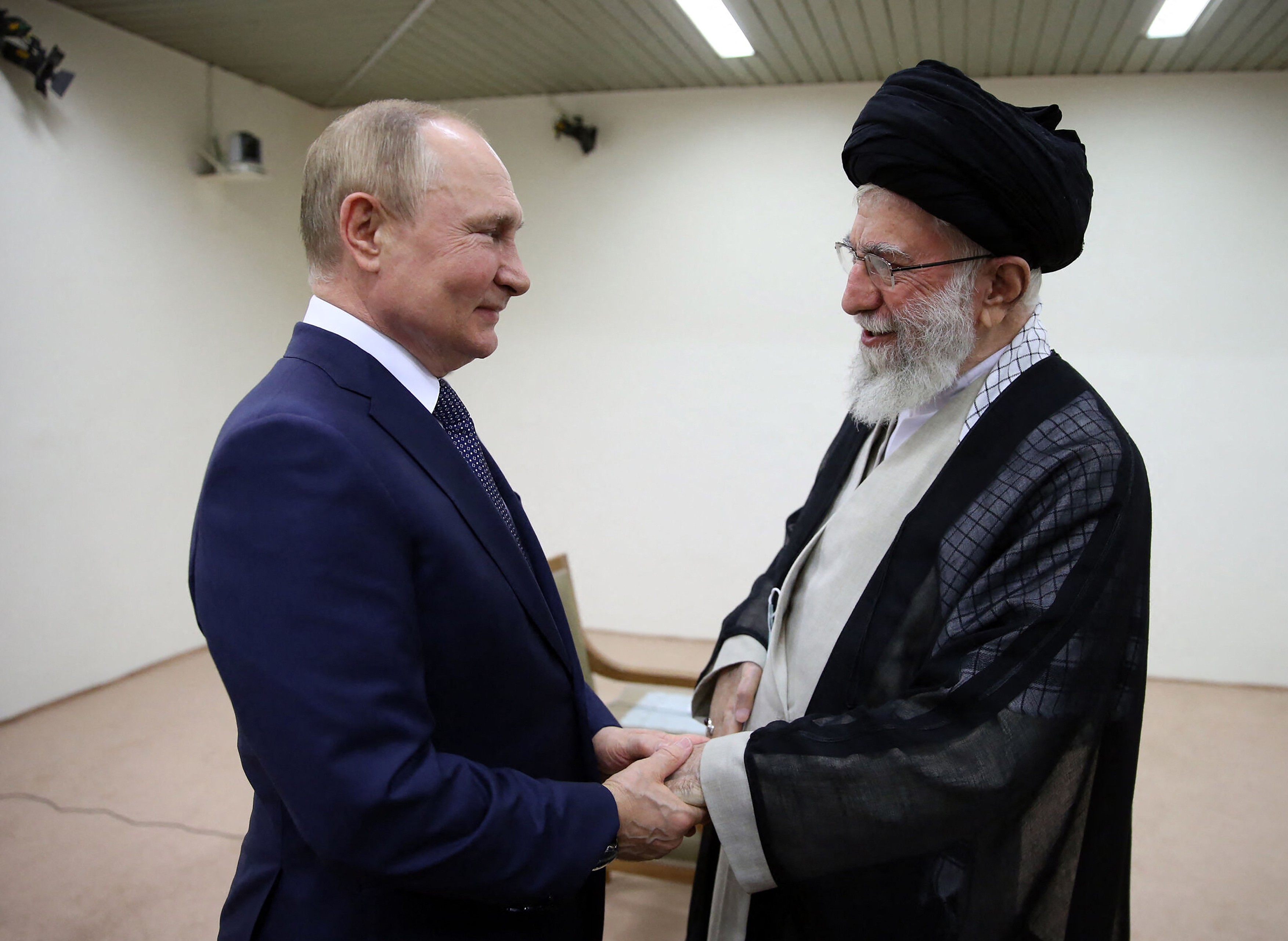 Iranian Supreme Leader Ayatollah Ali Khamenei (R) receiving Russian President  arrived in Tehran for talks on the Syrian war at a three-way summit