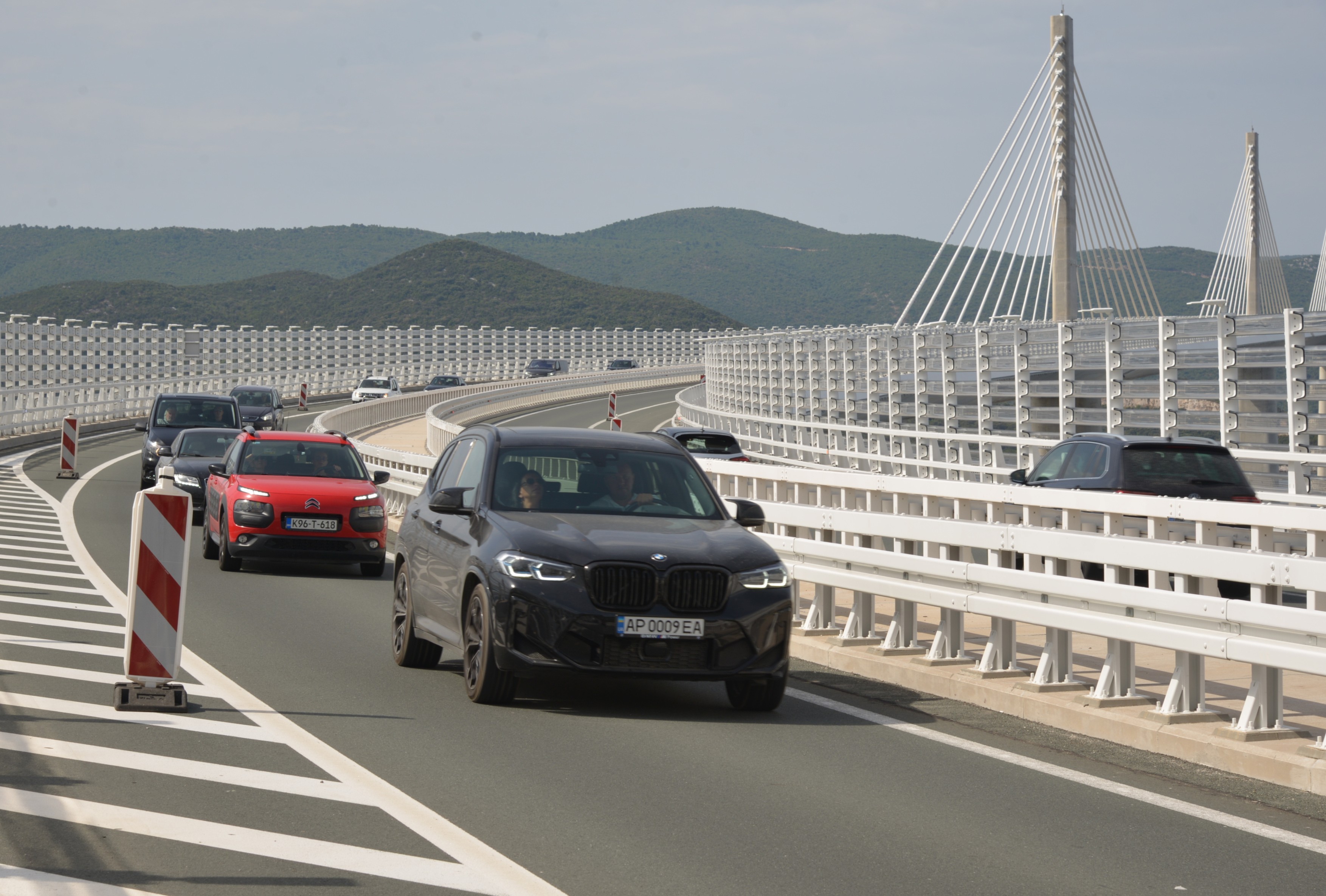 KOMARNA, July 26, 2025  -- Vehicles run on the Peljesac Bridge in Komarna