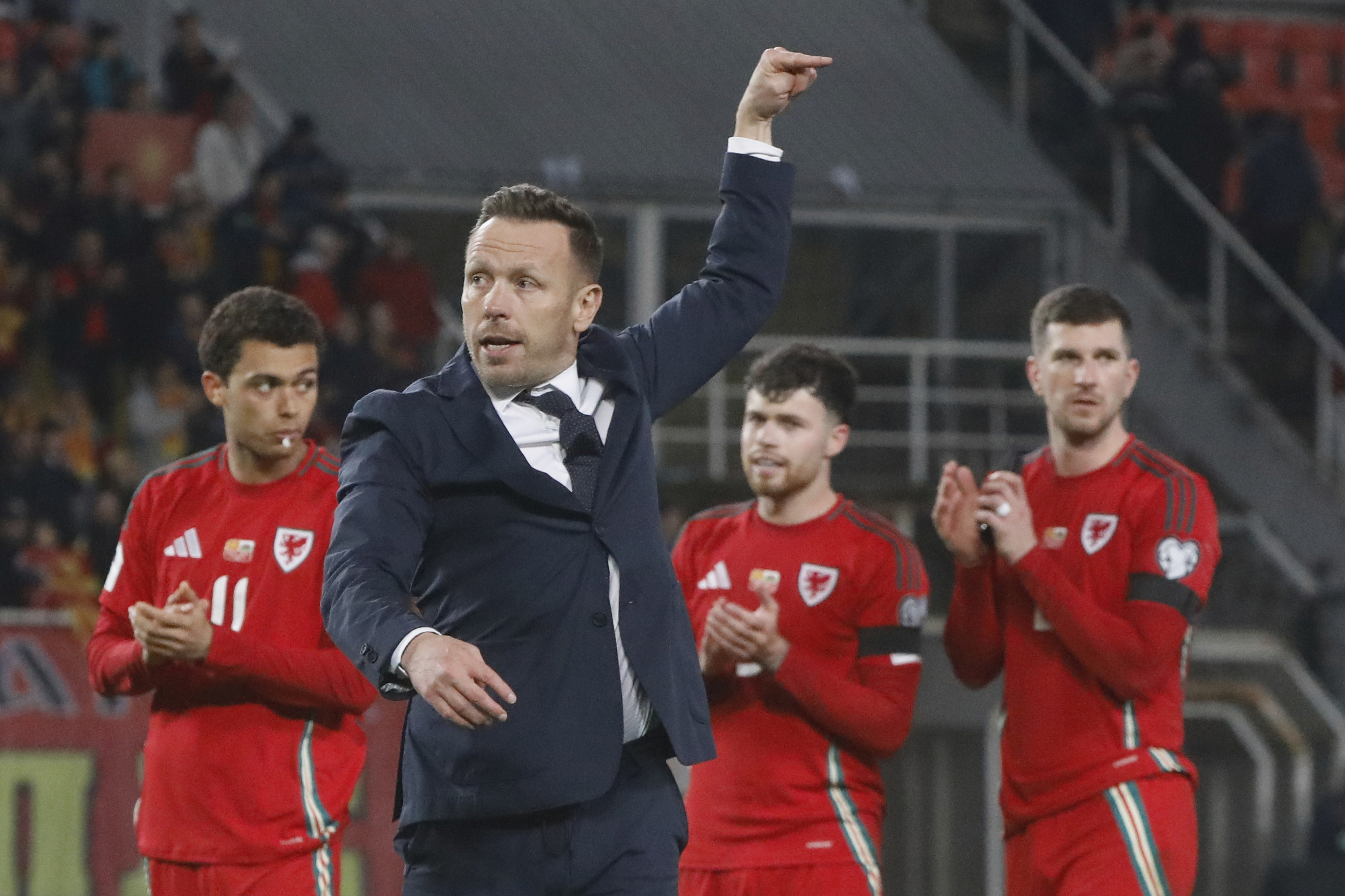 Wales' head coach Craig Bellamy celebrates at the end of a World Cup 2026 group J qualifying soccer match between North Macedonia and Wales at National Arena Todor Proeski in Skopje, North Macedonia, Tuesday, March 25, 2025. (AP Photo/Boris Grdanoski)