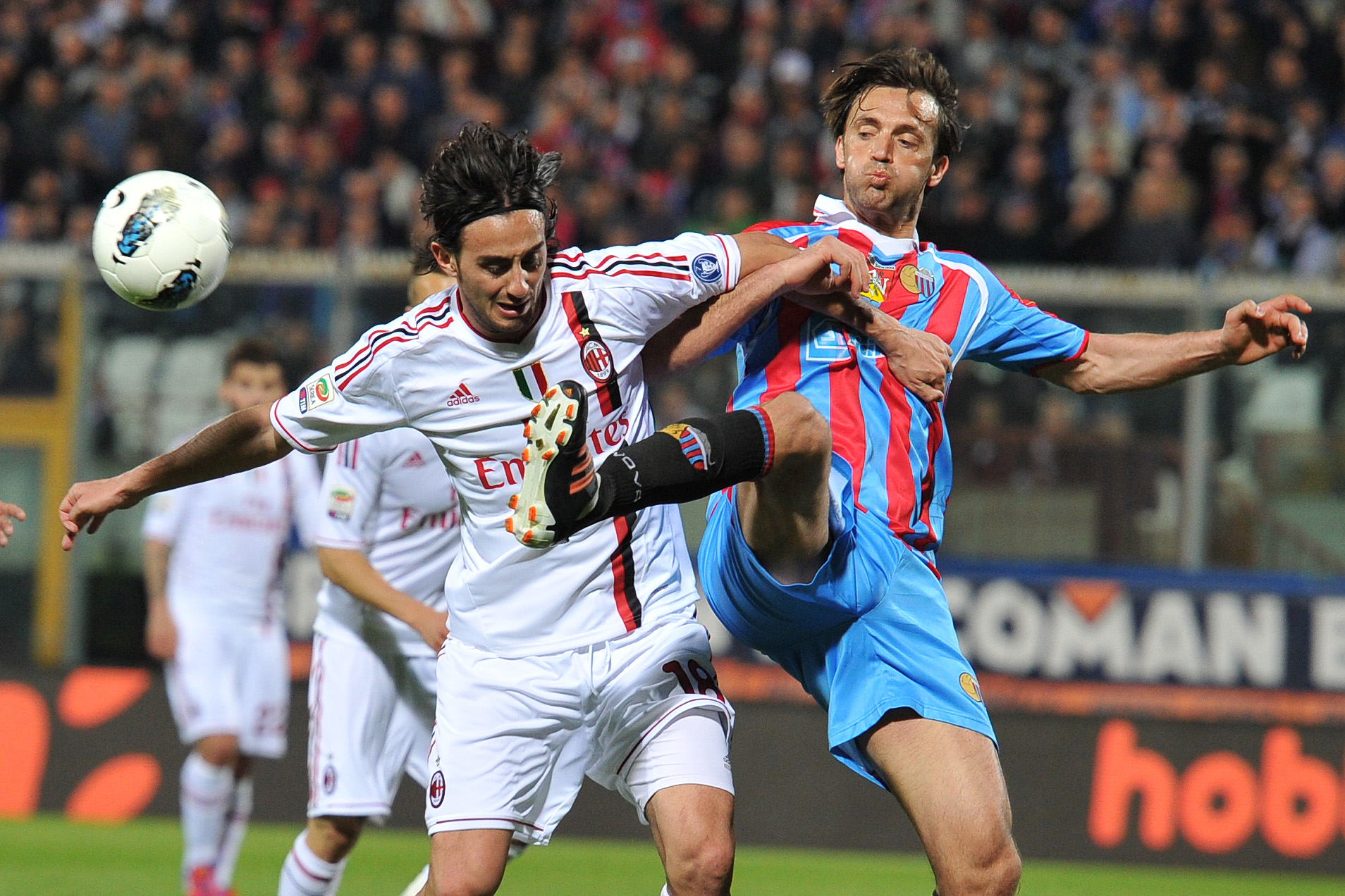 Catania defender Nicola Legrottaglie, right, vies for the ball with AC Milan midfielder Alberto Aquilani during  Serie A soccer match between Catania and AC Milan at the Angelo Massimino stadium in Catania, Italy, Saturday, March 31, 2012. (AP Photo/Carme