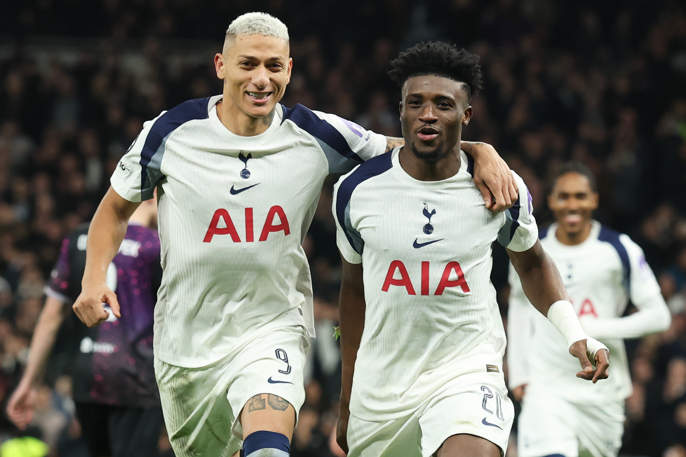 Tottenham's Mohammed Kudus, right, celebrates with Tottenham's Richarlison after scoring his sides second goal during the Champions League opening phase soccer match between Tottenham and Slavia Prague, in London, England, Tuesday, Dec. 9, 2025. (AP Photo