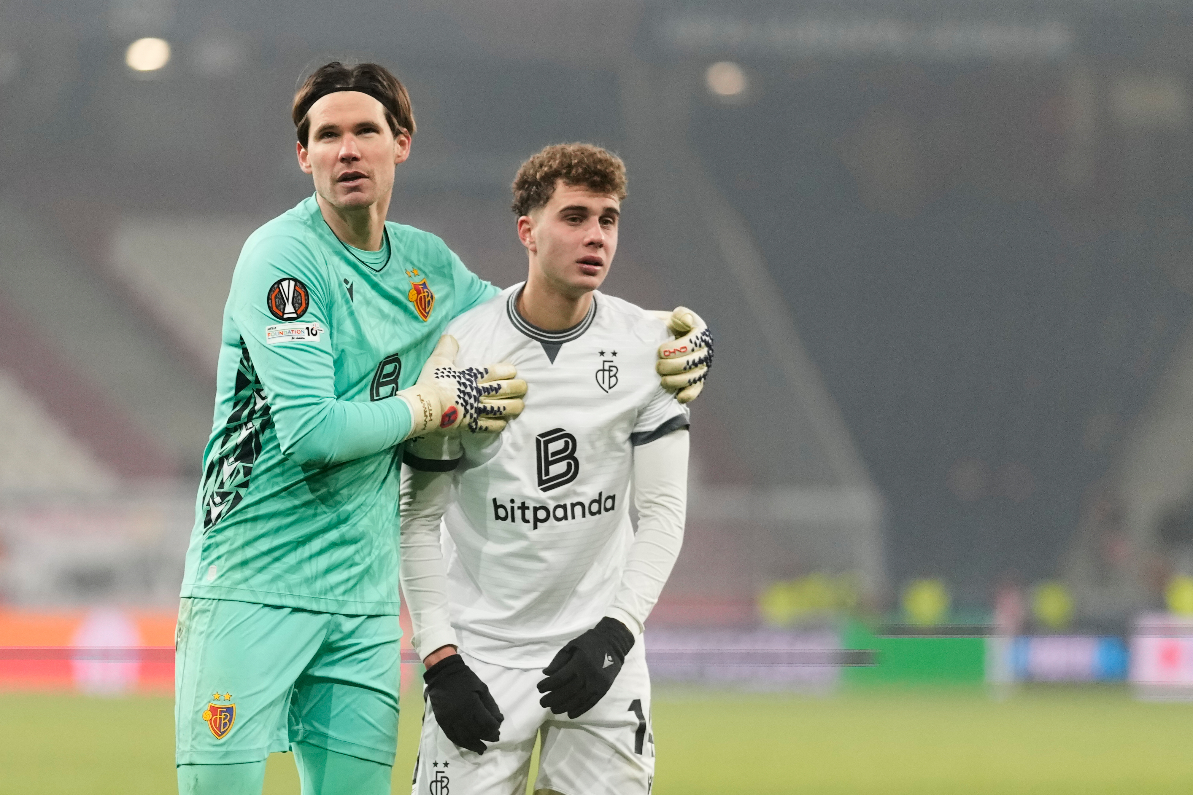 Basel's goalkeeper Marwin Hitz, left, and Basel's Andrej Bacanin react disappointed after the Europa League opening phase soccer match between FC Salzburg and Basel in Salzburg, Austria, Thursday, Jan. 22, 2026. (AP Photo/Matthias Schrader)