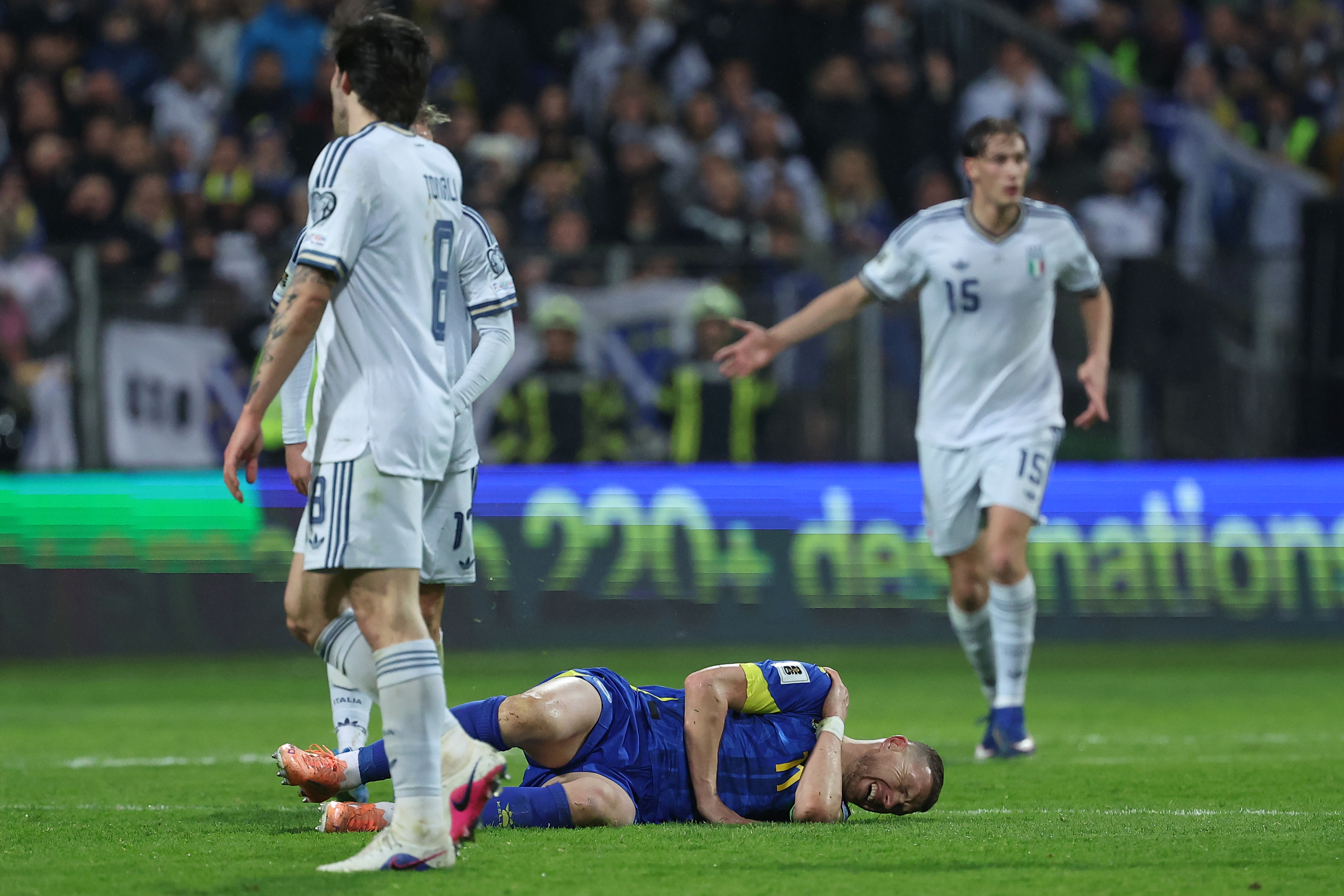 Bosnia's Edin Dzeko reacts after a challenge during the World Cup qualifying playoff final soccer match between Bosnia and Italy in Zenica, Bosnia, Tuesday, March 31, 2026. (AP Photo/Armin Durgut)