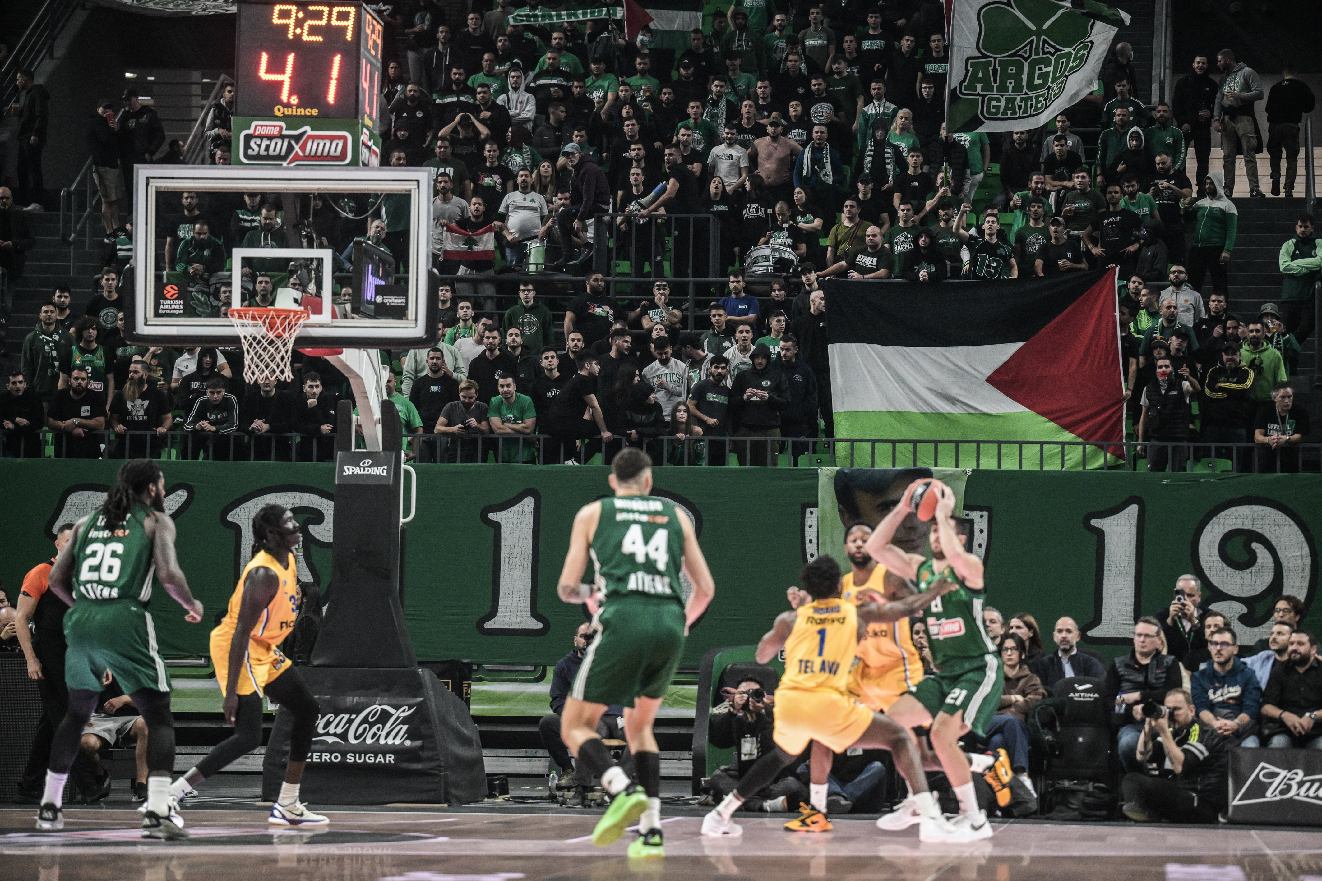 Fans of Panathinaikos hold a Palestinian flag during the Euroleague basketball match between Panathinaikos Athens and Maccabi Tel Aviv at the OAKA stadium in Athens on November 12, 2024. (Photo by Angelos TZORTZINIS / AFP)